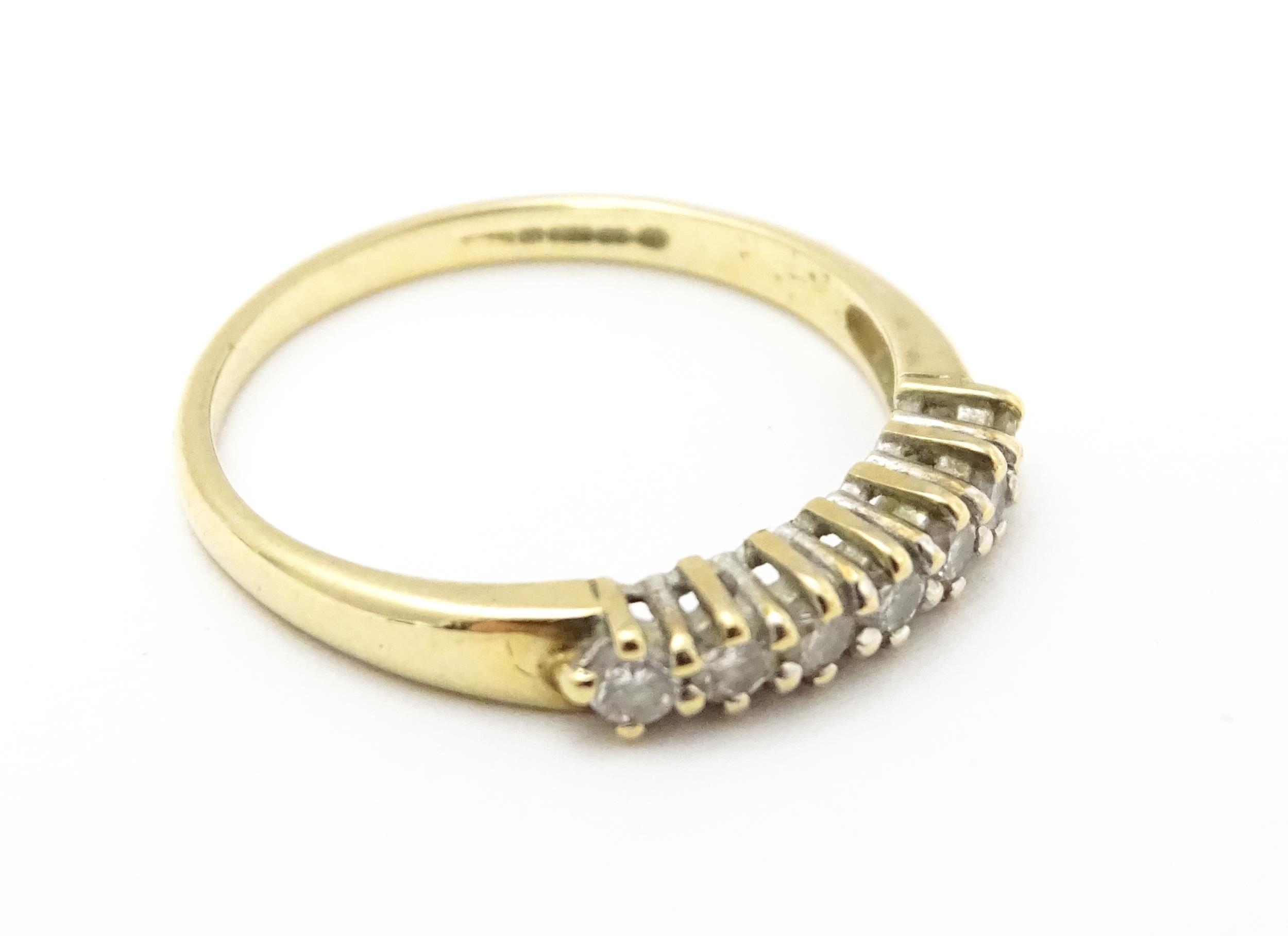 A 9ct gold ring set with seven diamonds in a linear setting. Ring size approx. K 1/2 Please Note - - Image 5 of 7