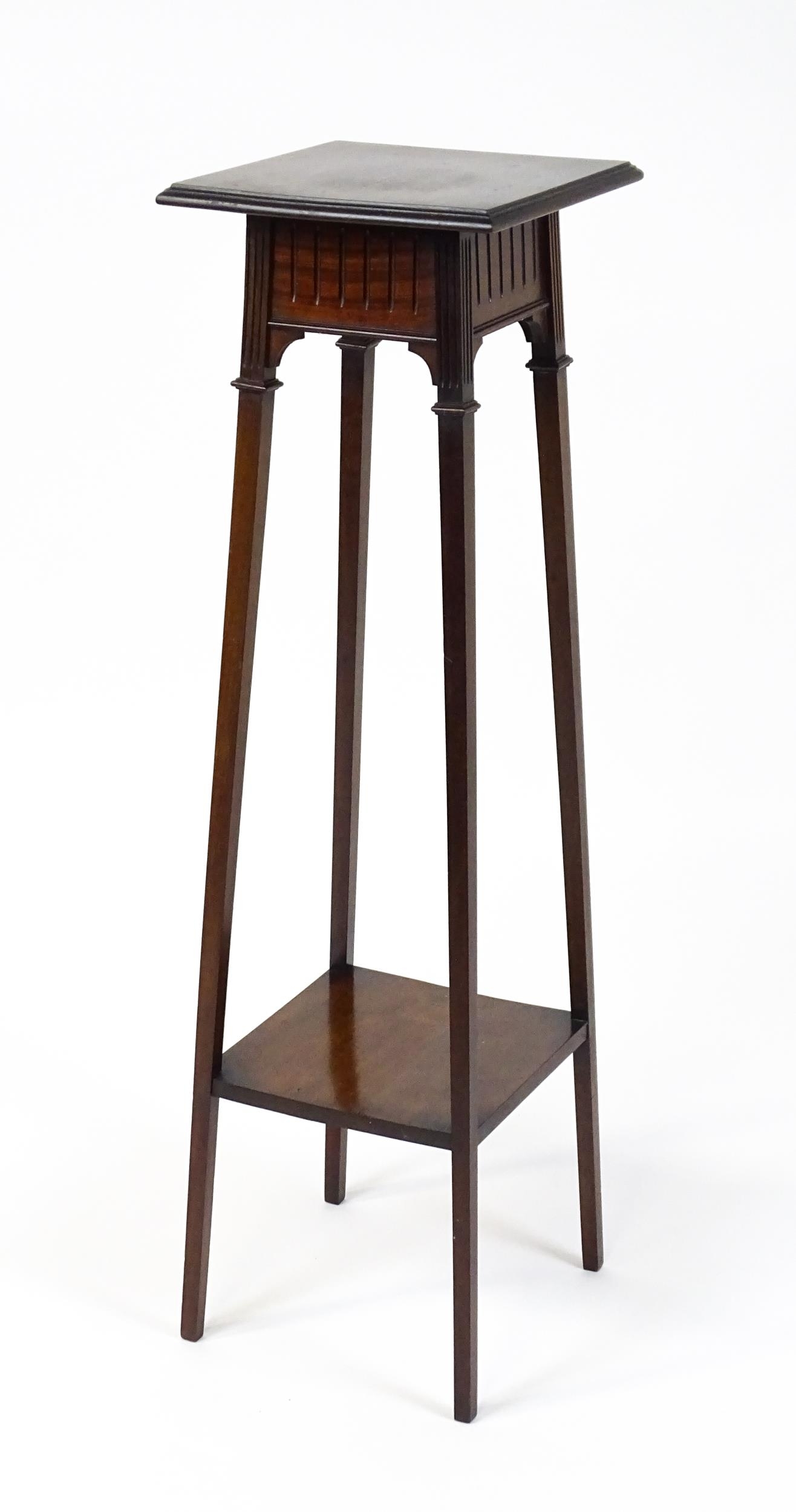 An early / mid 20thC mahogany jardinière stand with a moulded top above a fluted frieze raised on - Image 7 of 7