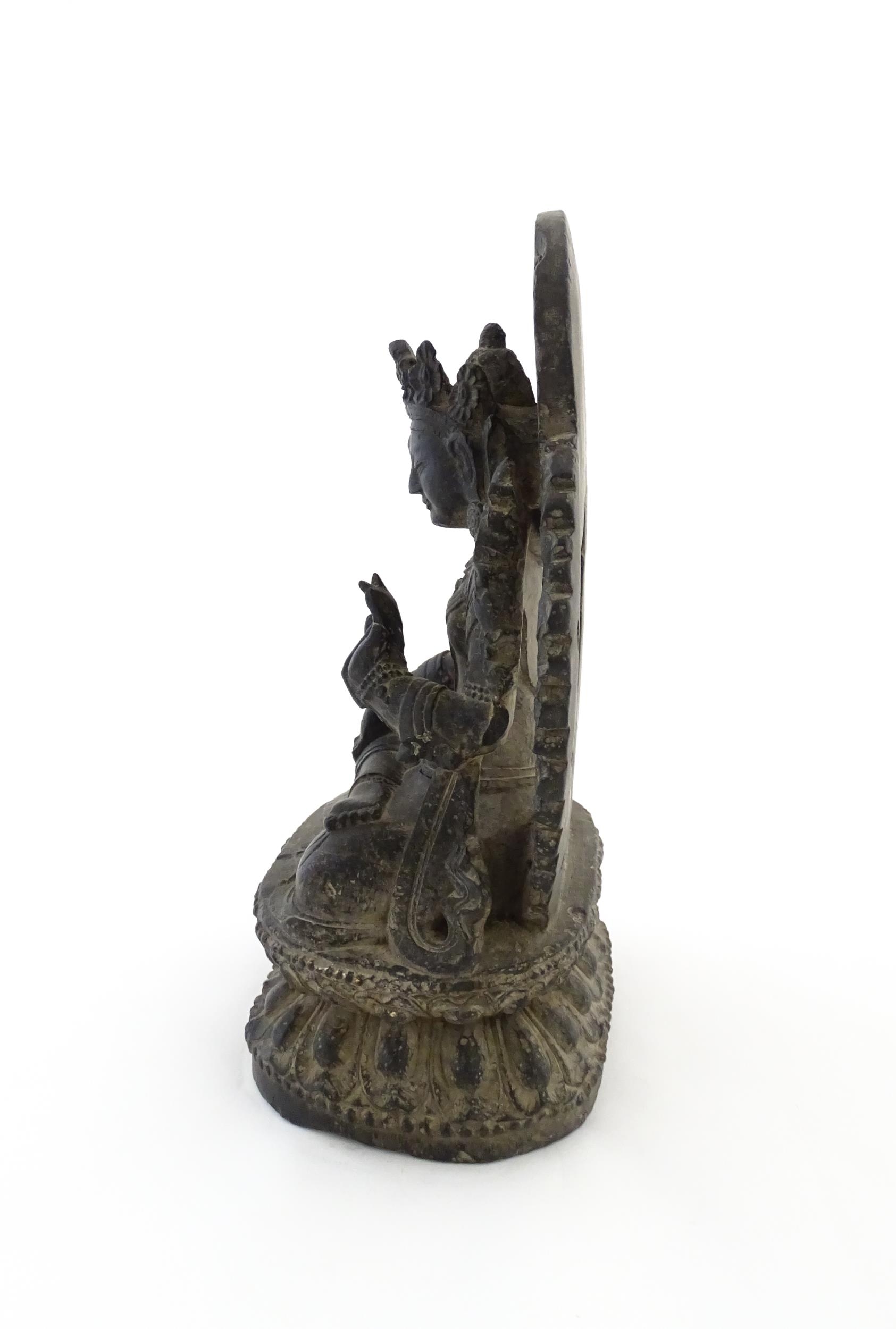 An Asian carved soapstone model of a seated deity on a stylised lotus. Approx. 14 1/2" high Please - Image 6 of 8