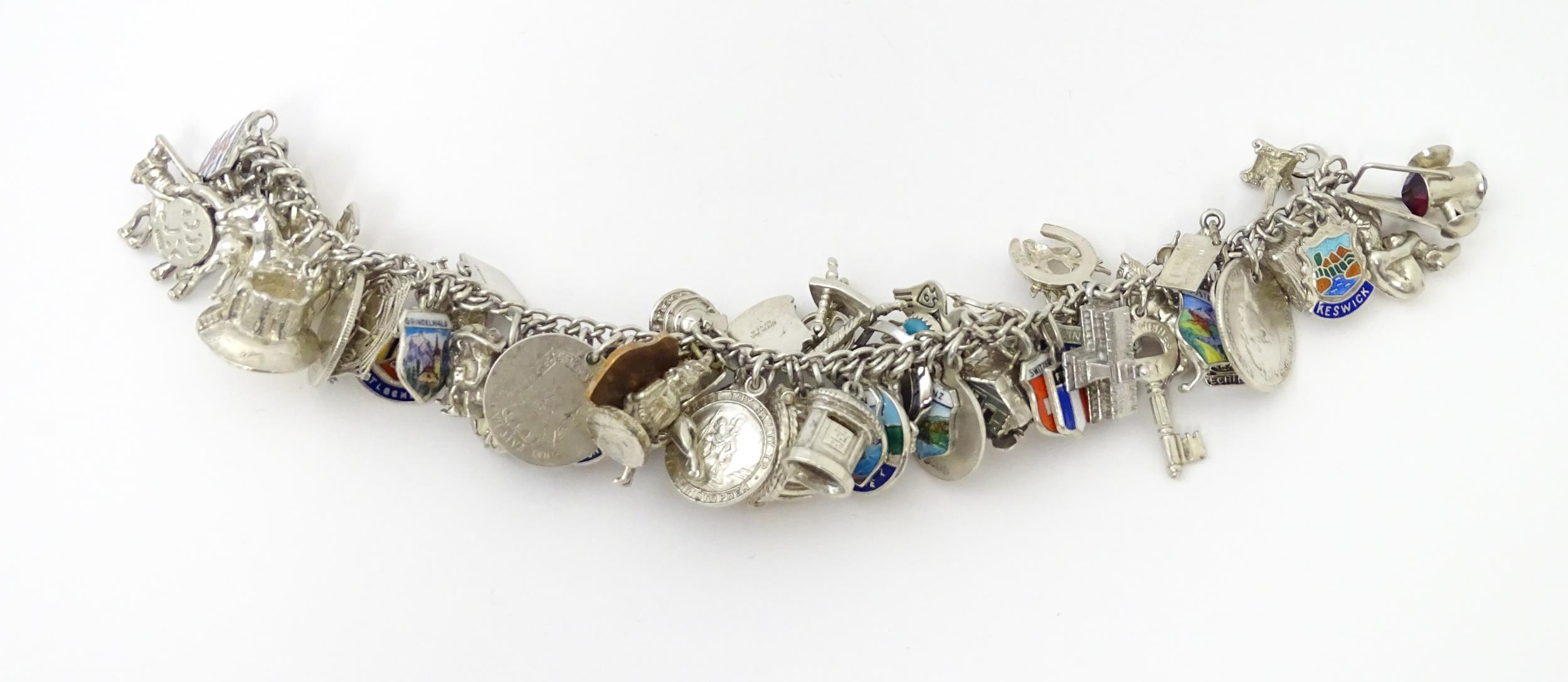 A silver charm bracelet set with various silver, white metal and silver plate charms Please Note - - Image 2 of 8