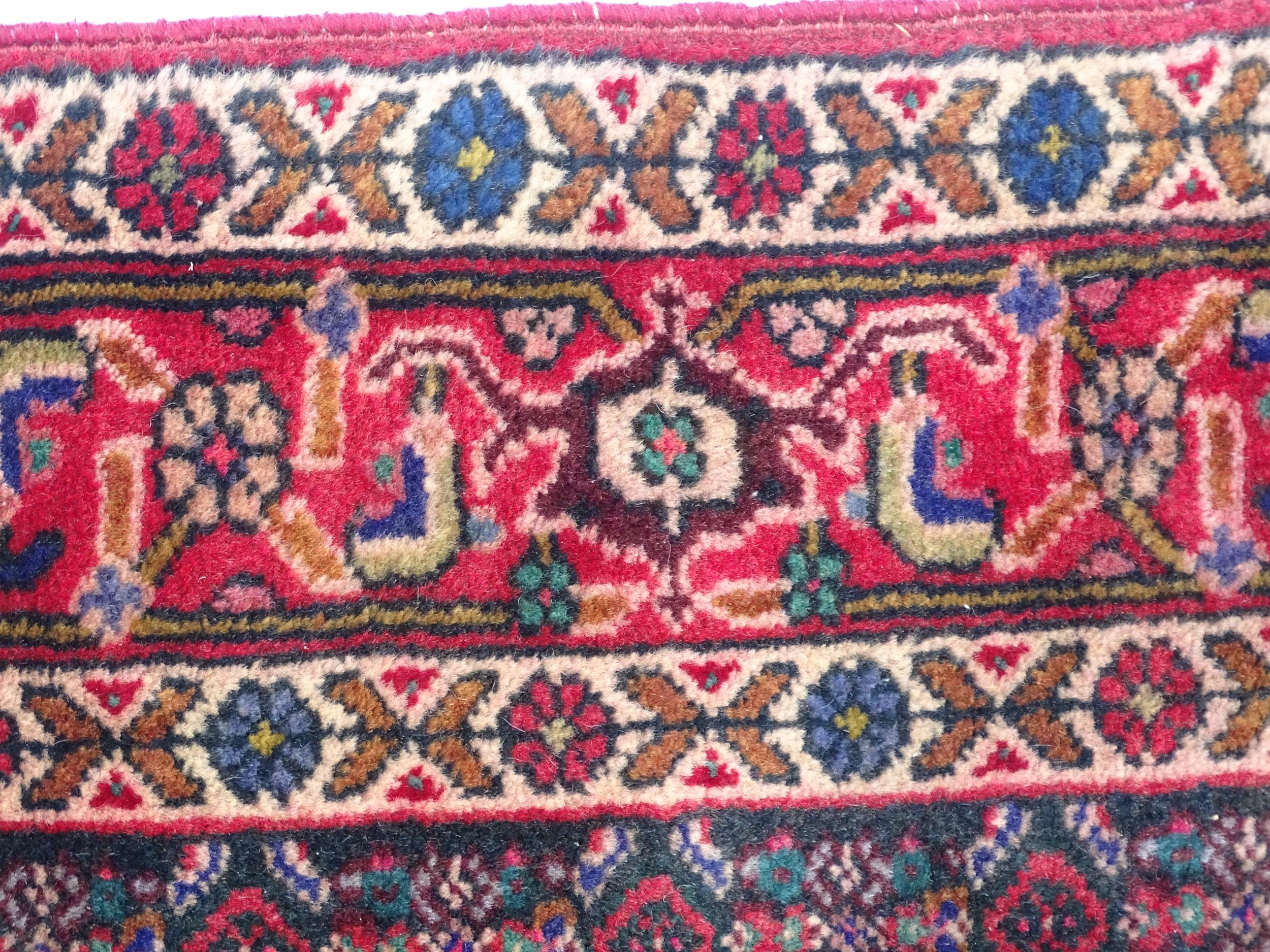 Carpet / Rug: A North West Persian Senneh rug, the red, blue and cream grounds decorated with - Image 4 of 7