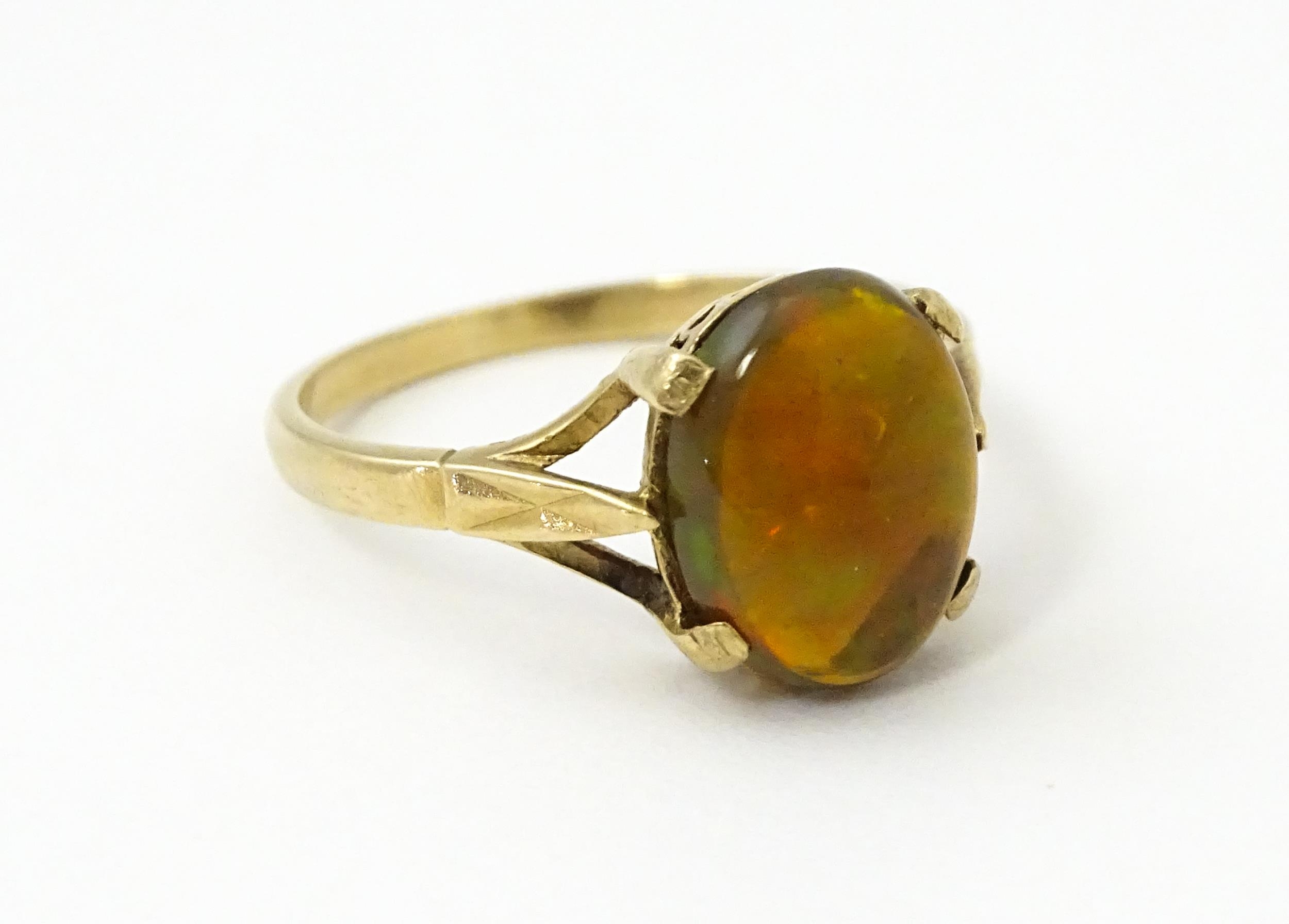 A 9ct gold ring set with fire opal cabochon. Ring size approx. R. Please Note - we do not make - Image 5 of 7