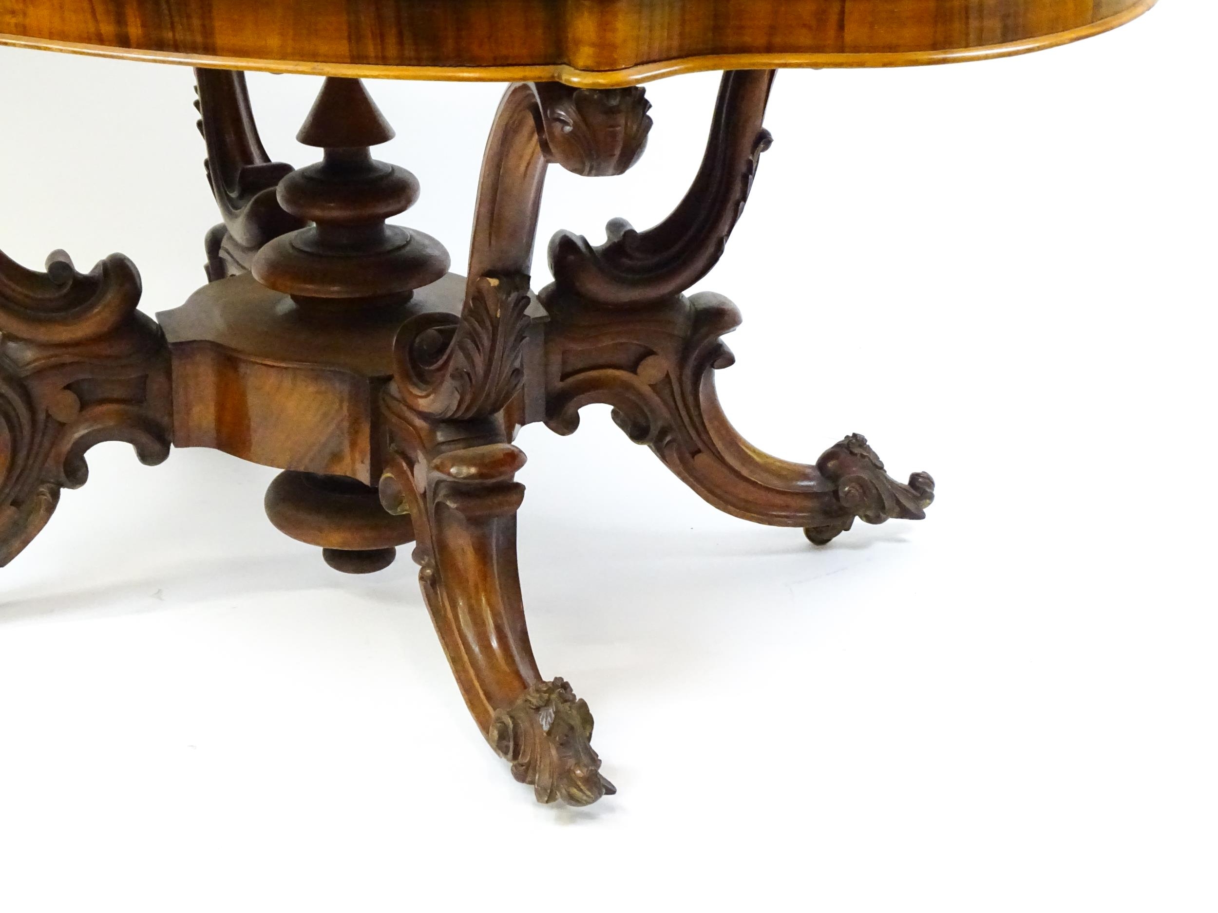 A 19thC burr walnut centre table with a moulded top above four acanthus carved supports, a large - Image 16 of 16