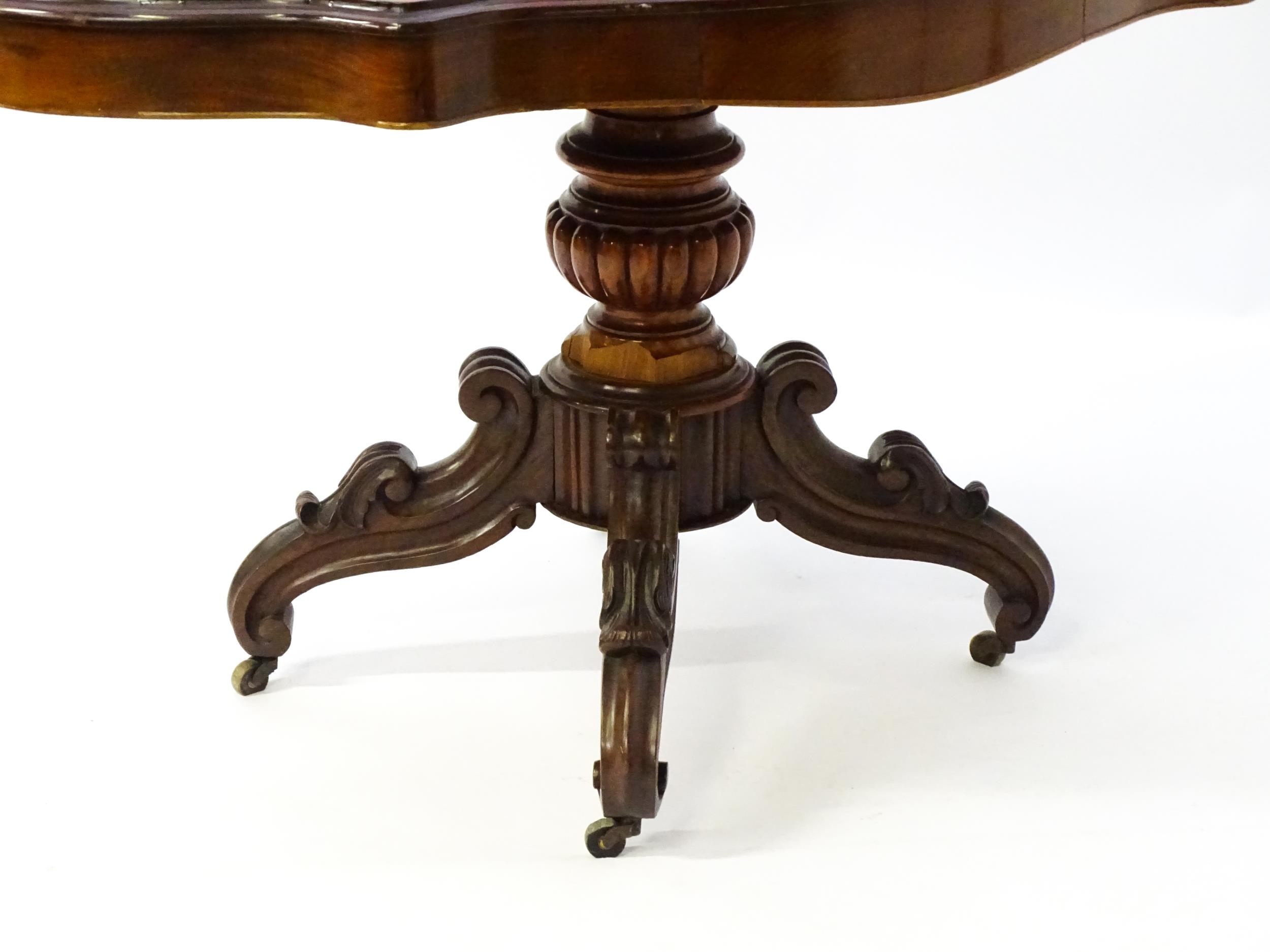 A 19thC mahogany centre table with a moulded top having two frieze drawers, the pedestal having - Image 4 of 9