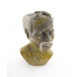 Ethnographic / Native / Tribal : An African carved soapstone bust modelled as a man with a