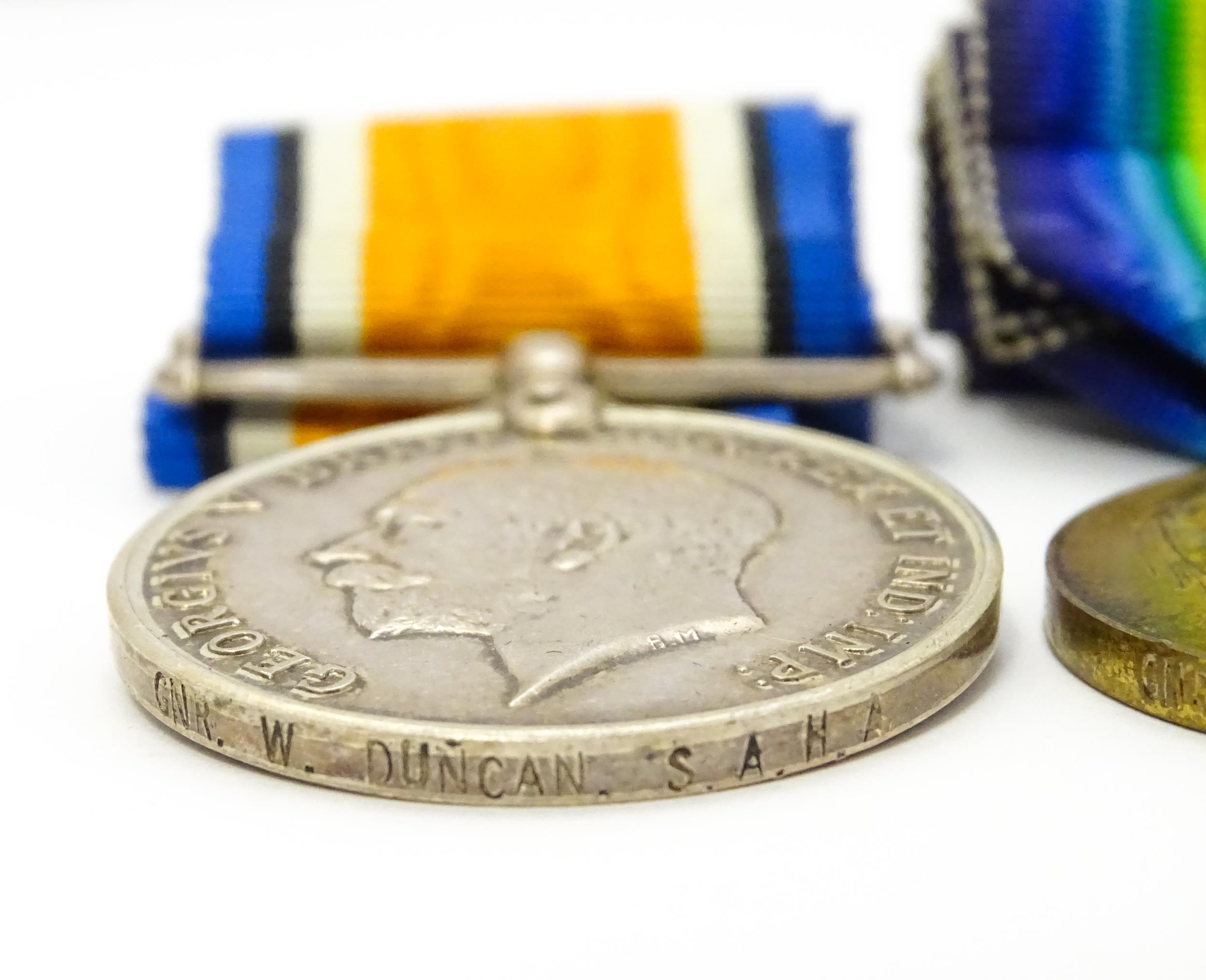 Militaria : a quantity of 20thC medals and insignia, comprising two WWI campaign medals to Gnr. W. - Image 14 of 16