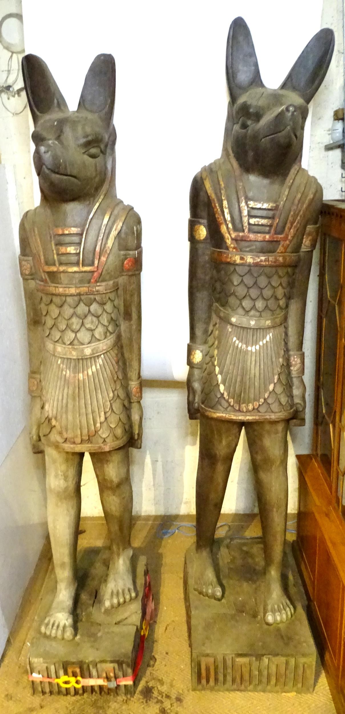 A pair of very large 20thC carved wooden standing Anubis / Ancient Egyptian dog god statues with