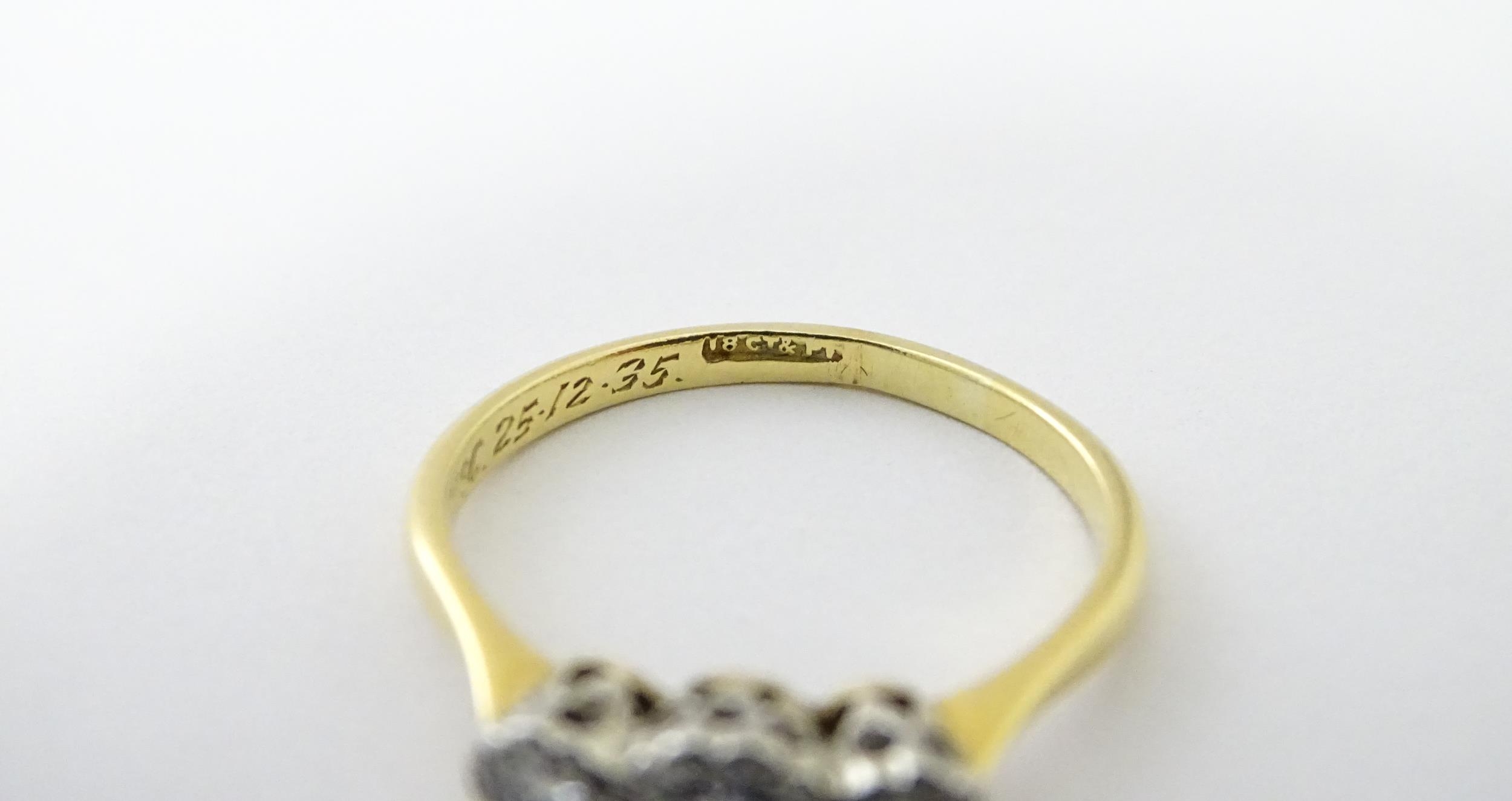 An 18ct gold ring with three platinum set diamonds. Ring size approx. O Please Note - we do not make - Image 12 of 18