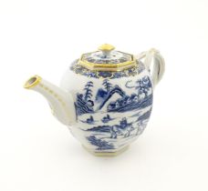 A Chinese export blue and white teapot decorated with figures and water buffalo in a landscape