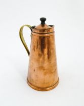 WAS Benson: An Arts & Crafts copper and brass insulated / jacketed hot water jug of tapering form.