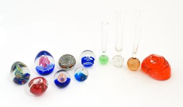 A quantity of assorted art glass paperweights and vases, to include bud vases and a Murano style
