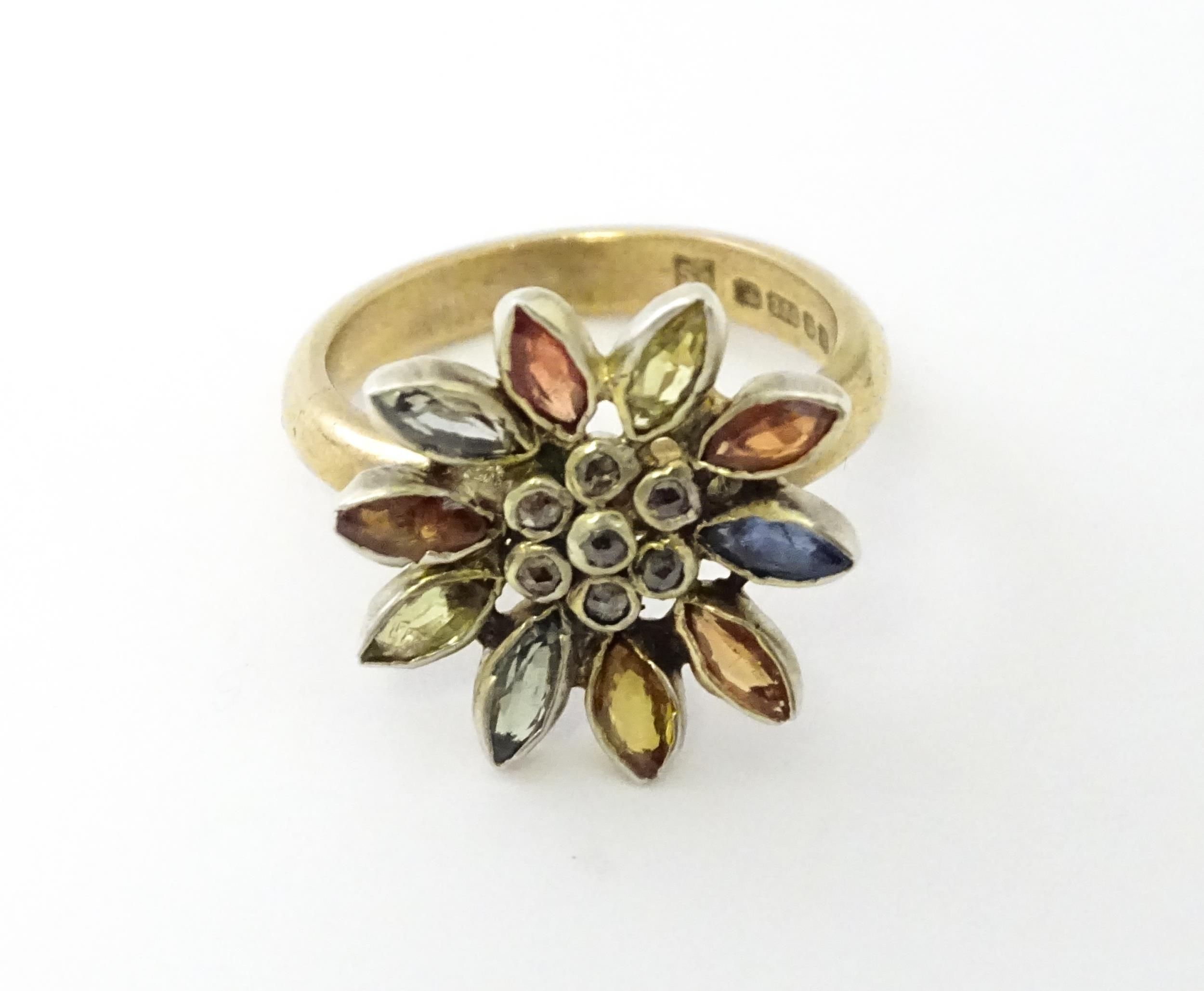 A 9ct gold ring set with central diamonds bordered by various coloured stones in a flower setting. - Image 5 of 6
