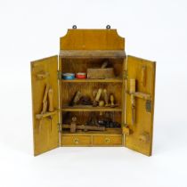 An early / mid 20thC wall hanging work box , containing carpentry / woodworking tools to include