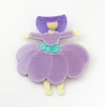 Lea Stein Paris : A brooch formed as a lady wearing a hat. Approx. 2 3/4" high Please Note - we do