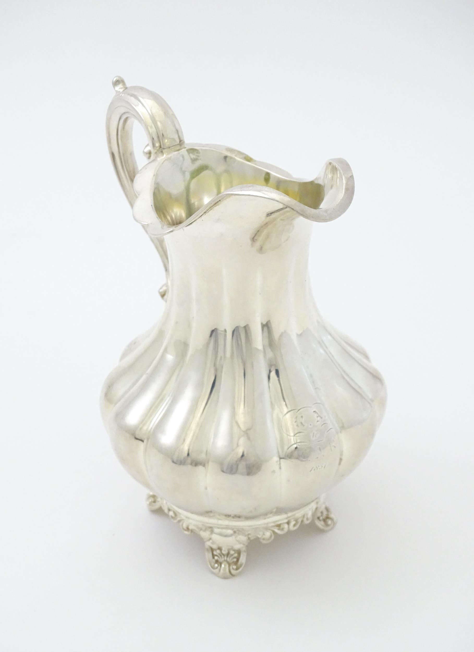 A Victorian silver jug hallmarked London 1851, maker Samuel Hayne & Dudley Cater. Approx. 6 1/4" - Image 4 of 6