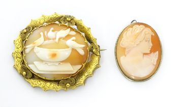 Two cameo brooches, one a classical cameo set within a .800 silver mount. The other a Victorian