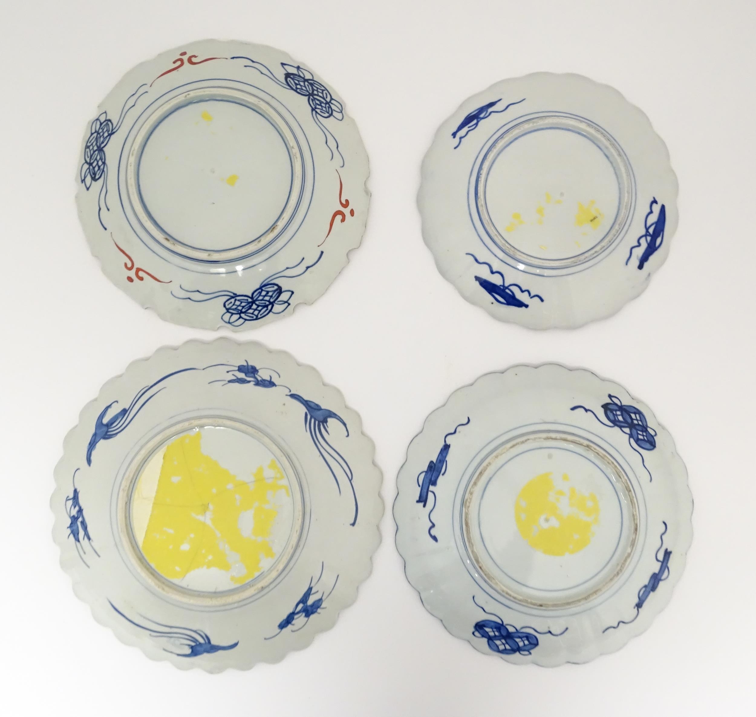 Four Japanese chargers with shaped edges decorated in the Imari palette with flowers, foliage and - Image 2 of 7