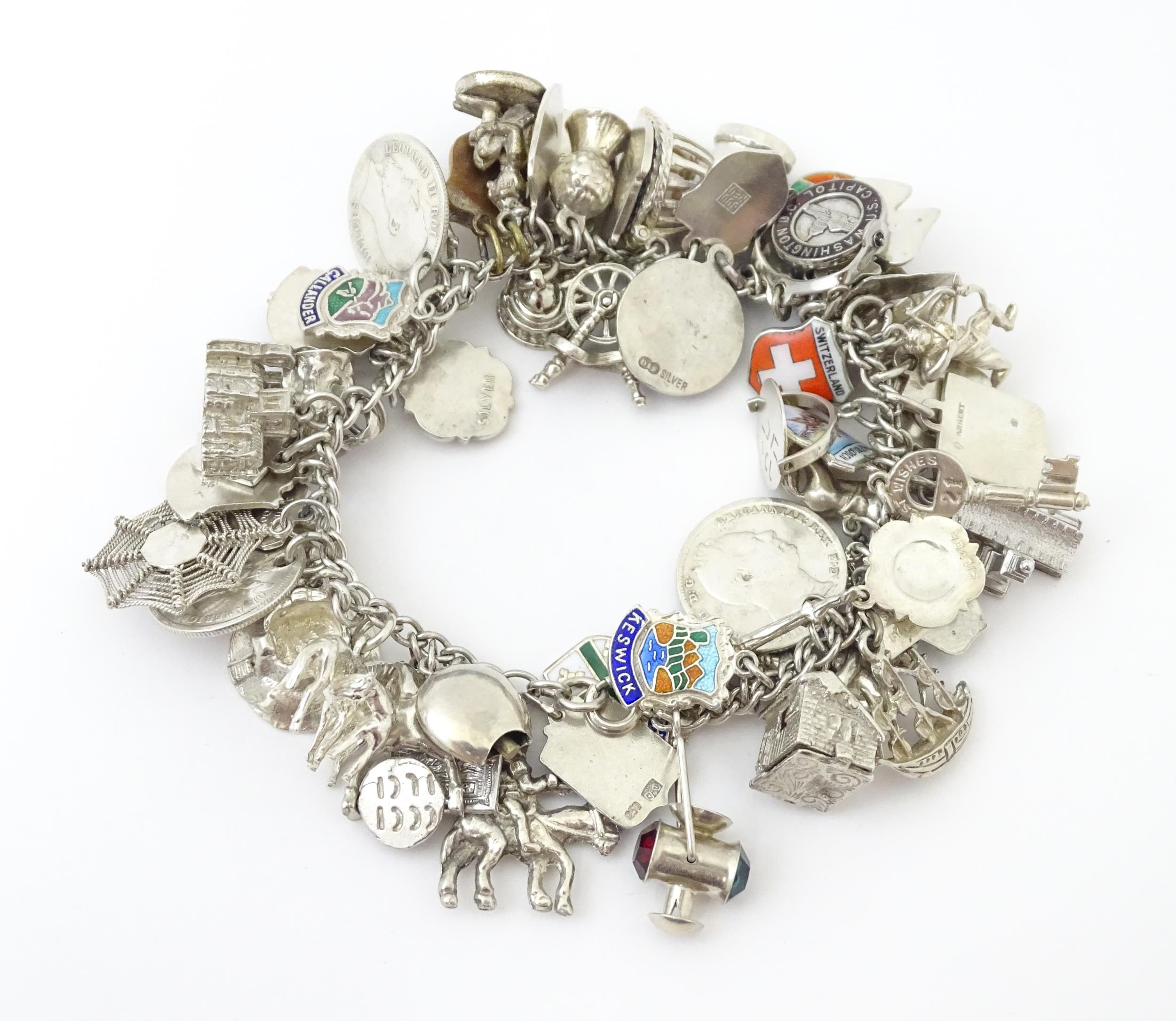 A silver charm bracelet set with various silver, white metal and silver plate charms Please Note - - Image 3 of 8