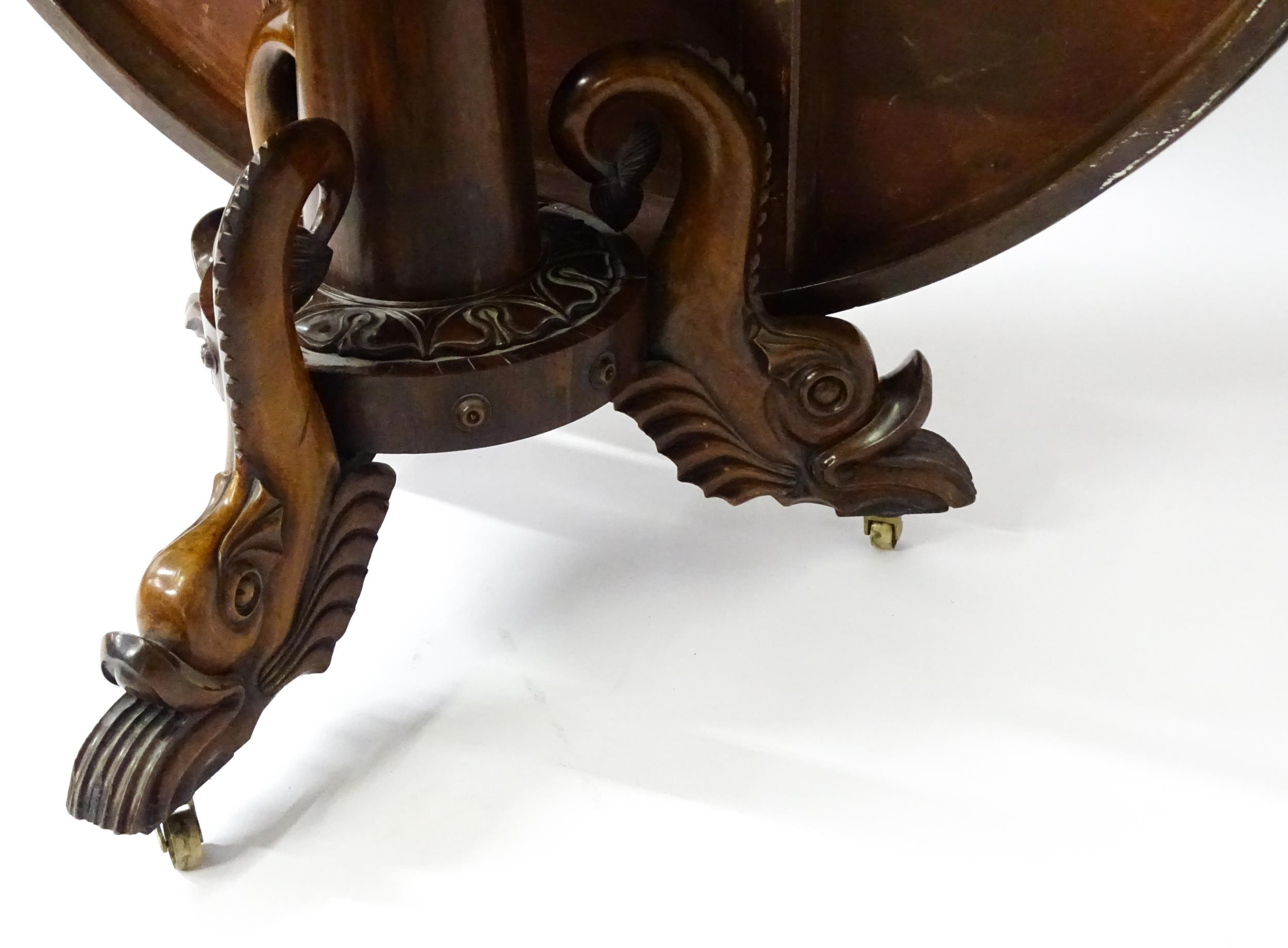 A 19thC dining table with an olive wood veneered circular top raised on a rosewood pedestal with - Image 9 of 15