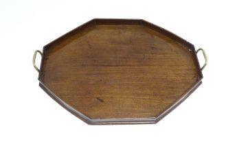 A late 19th / early 20thC mahogany tray of octagonal form with twin handles. Approx. 21 1/4" x 16