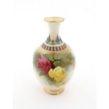 A Royal Worcester vase with hand painted decoration depicting pink and yellow roses, with gilt