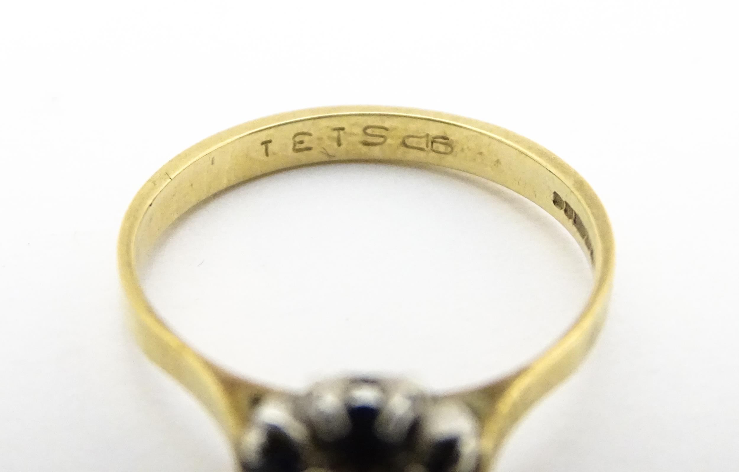 A 9ct gold ring set with diamonds and blue stones. Ring size approx. L Please Note - we do not - Image 6 of 7