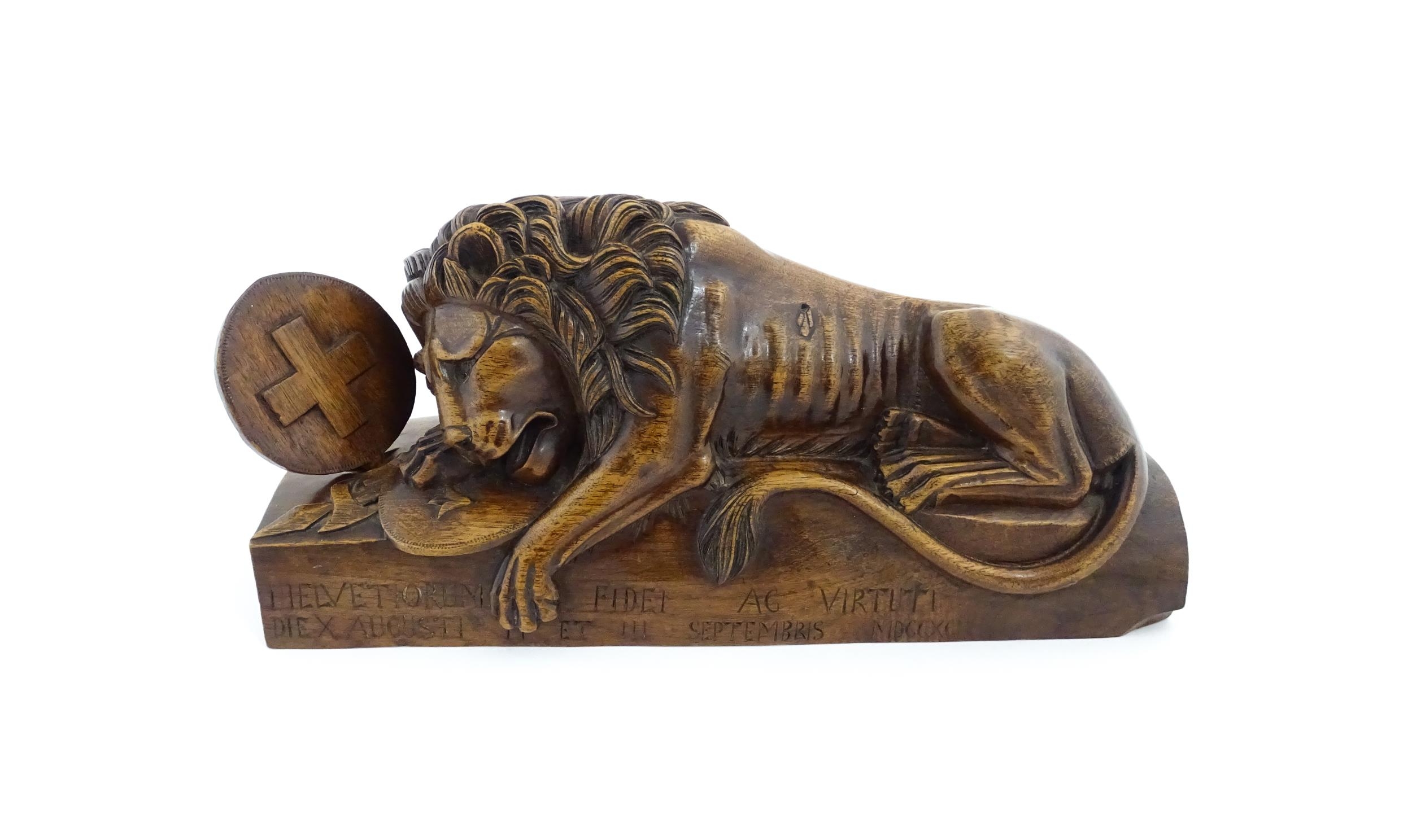 A late 19thC carved walnut model of the Lion of Lucerne after Bertel Thorvaldsen, inscribed