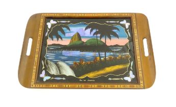 A 20thC Brazilian twin handled tray set with central scene depicting a Rio de Janeiro view with