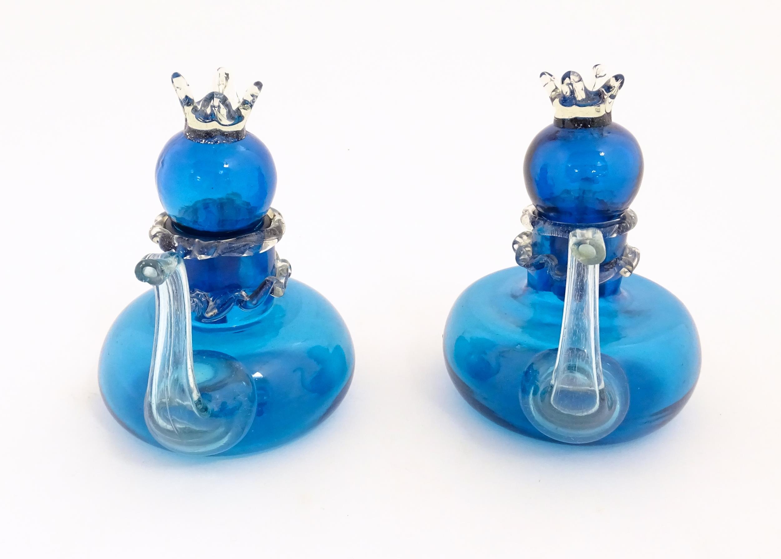 An unusual pair of turquoise glass oil / vinegar bottles of teapot form, the lids surmounted by - Image 6 of 11