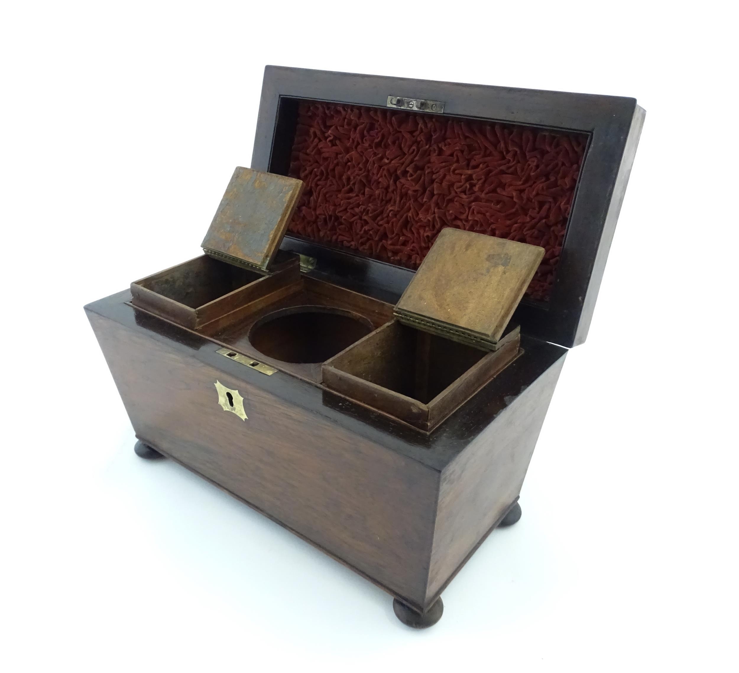 A 19thC rosewood tea caddy of sarcophagus form with four squat bun feet. The interior with two - Image 10 of 15