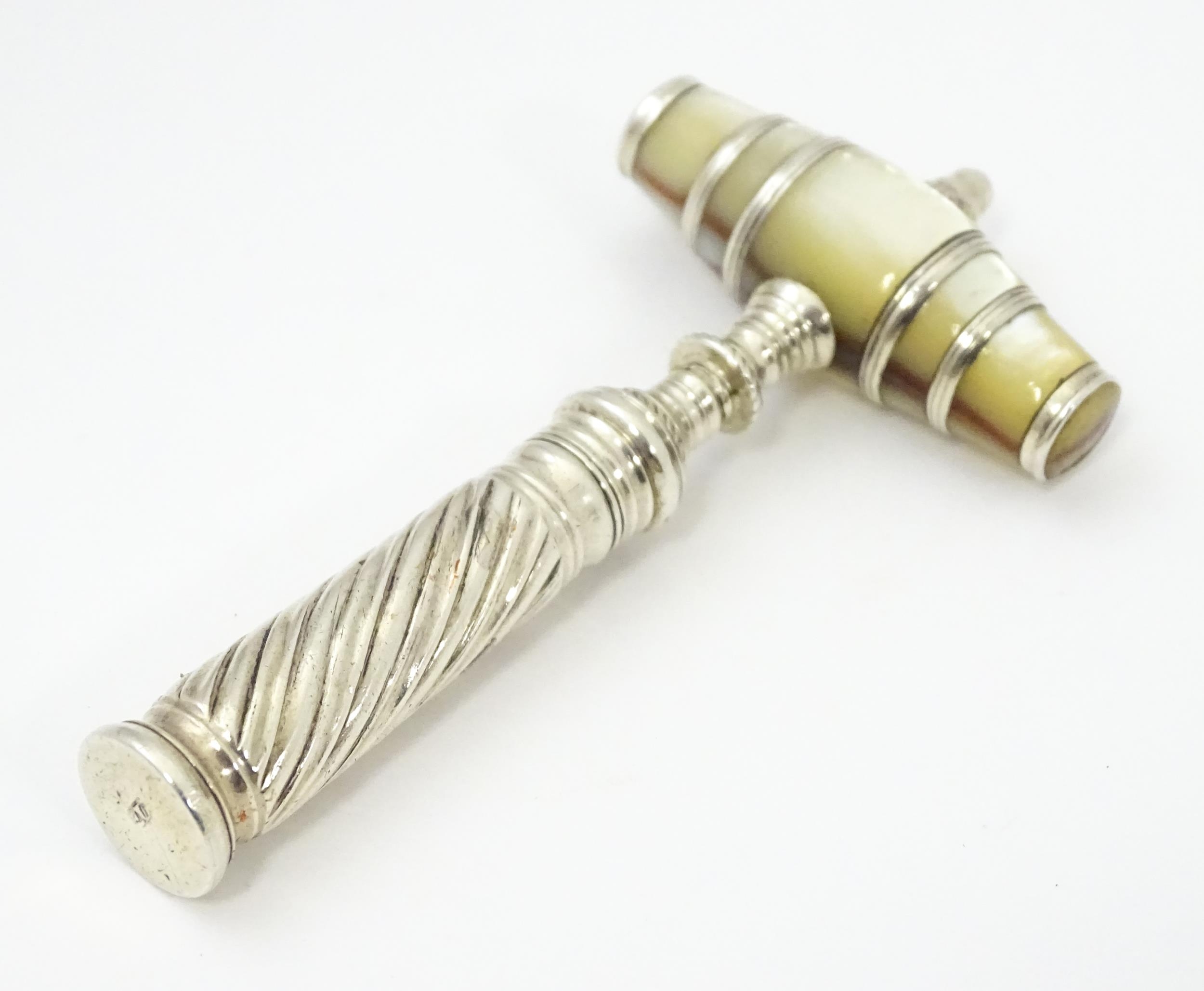 An 18thC silver pocket / travelling corkscrew with mother of pearl handle of barrel form, maker
