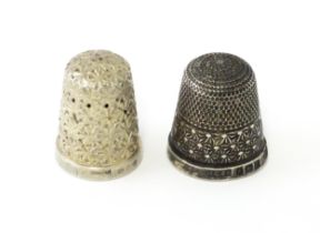 Two silver thimbles, one hallmarked Birmingham 1898, the other hallmarked 1930 maker Henry
