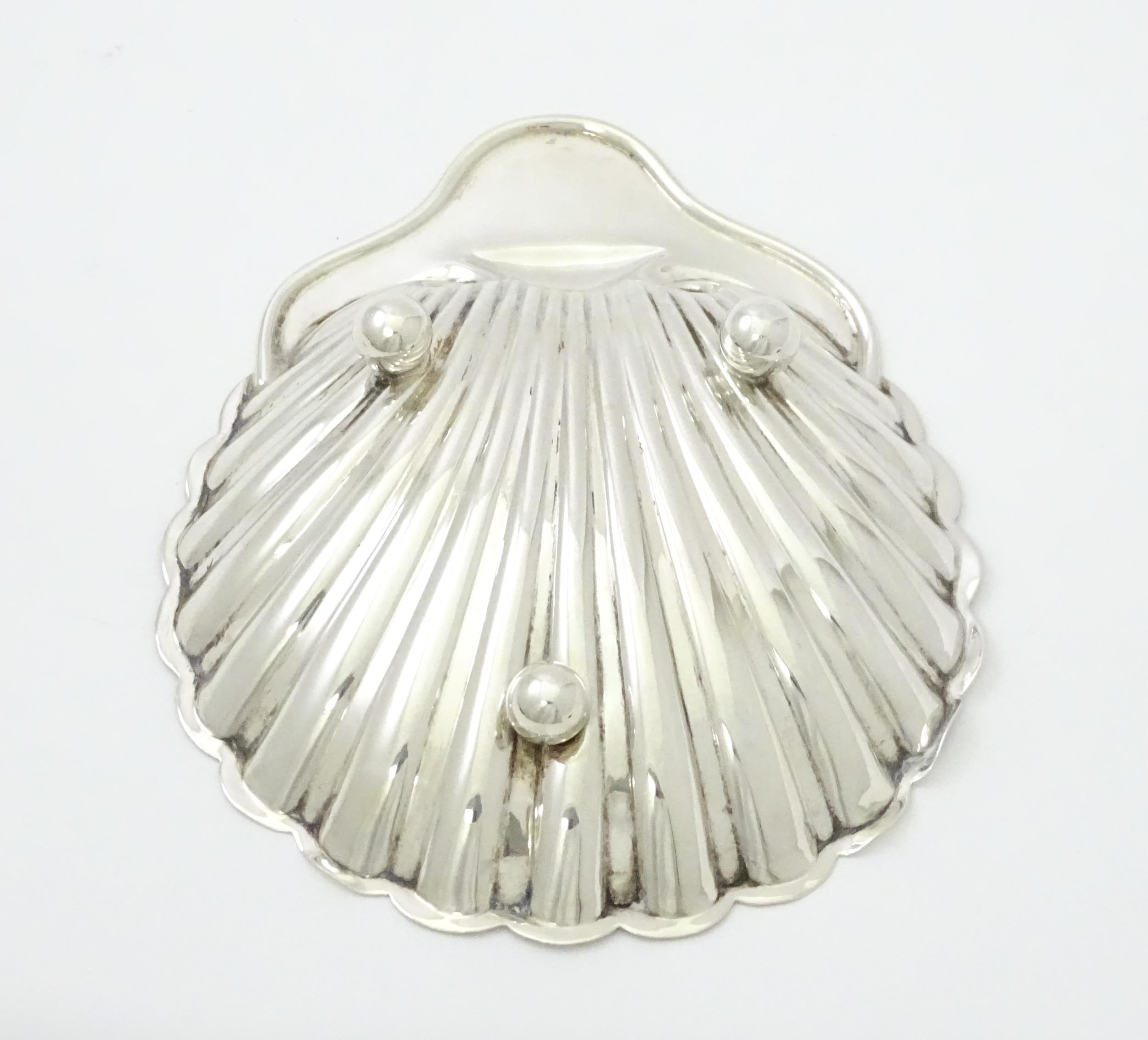 A silver butter dish of scallop shell form hallmarked Birmingham 1902, maker William Aitken. Approx. - Image 7 of 7