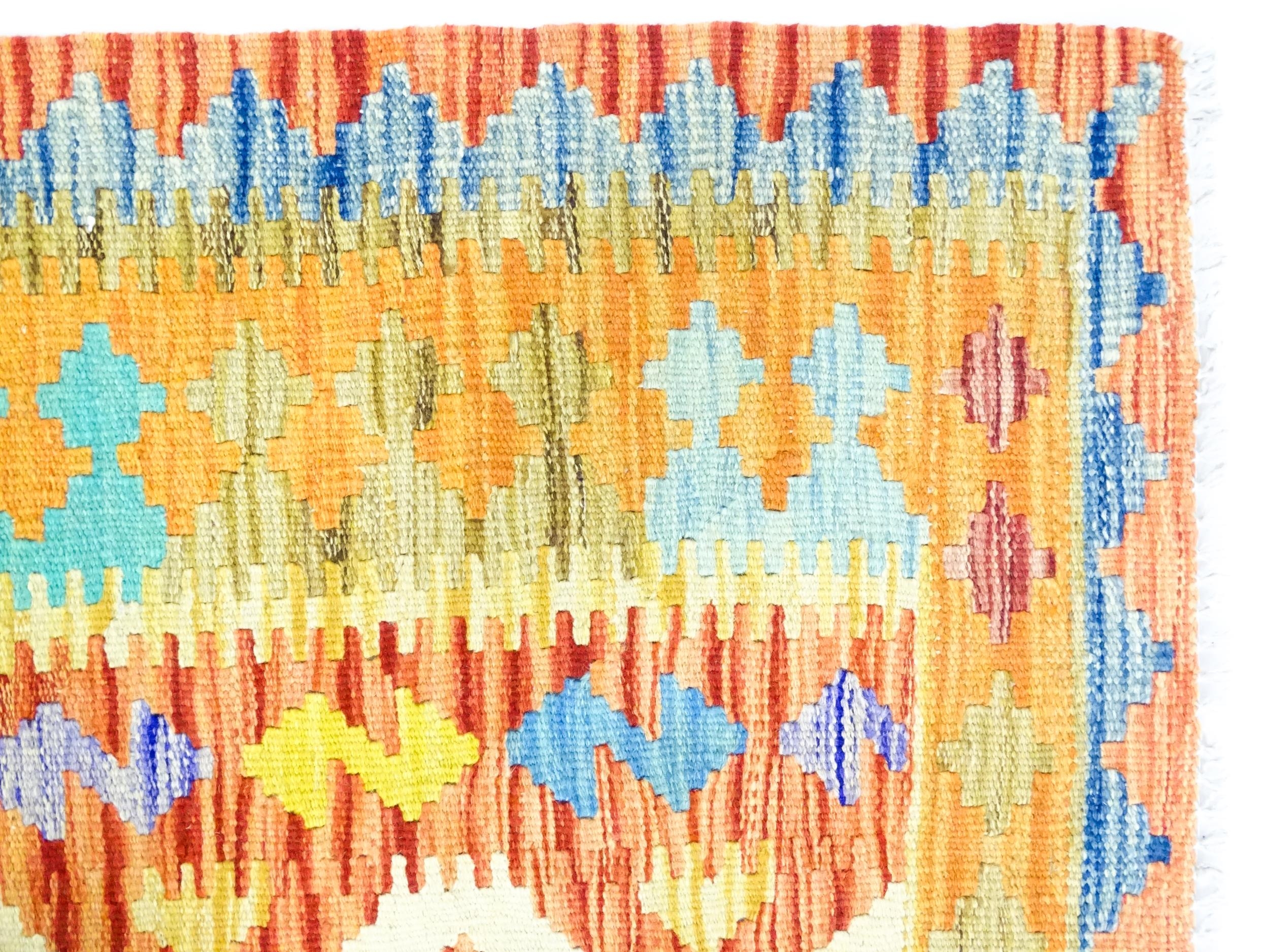 Carpet / Rug : A Turkish Anatolian kilim rug with repeating geometric motifs. Approx. 72" x 48" - Image 3 of 7