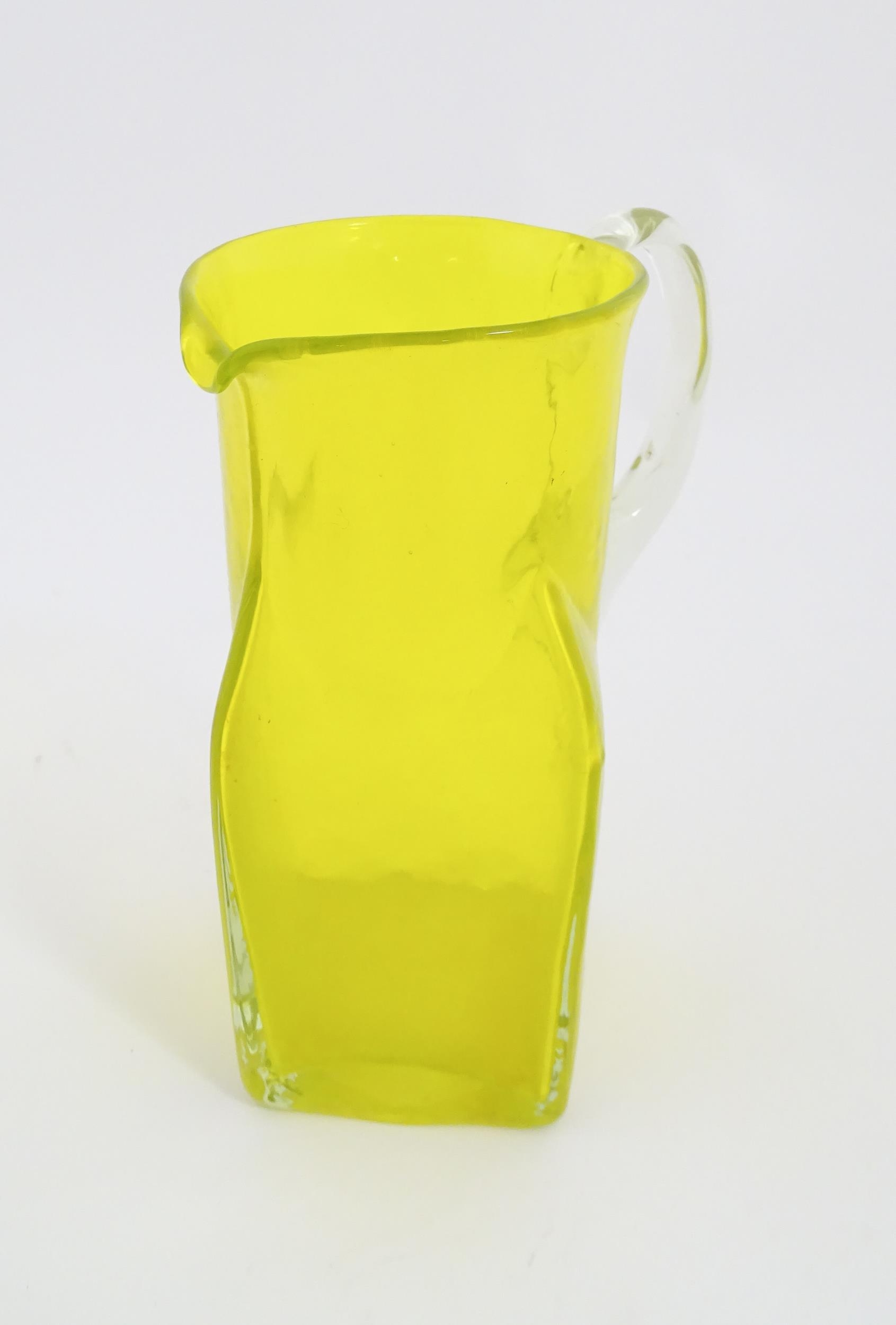 A 20thC yellow glass jug with squared base and clear glass handle. Approx. 8 1/2" high Please Note - - Image 9 of 11