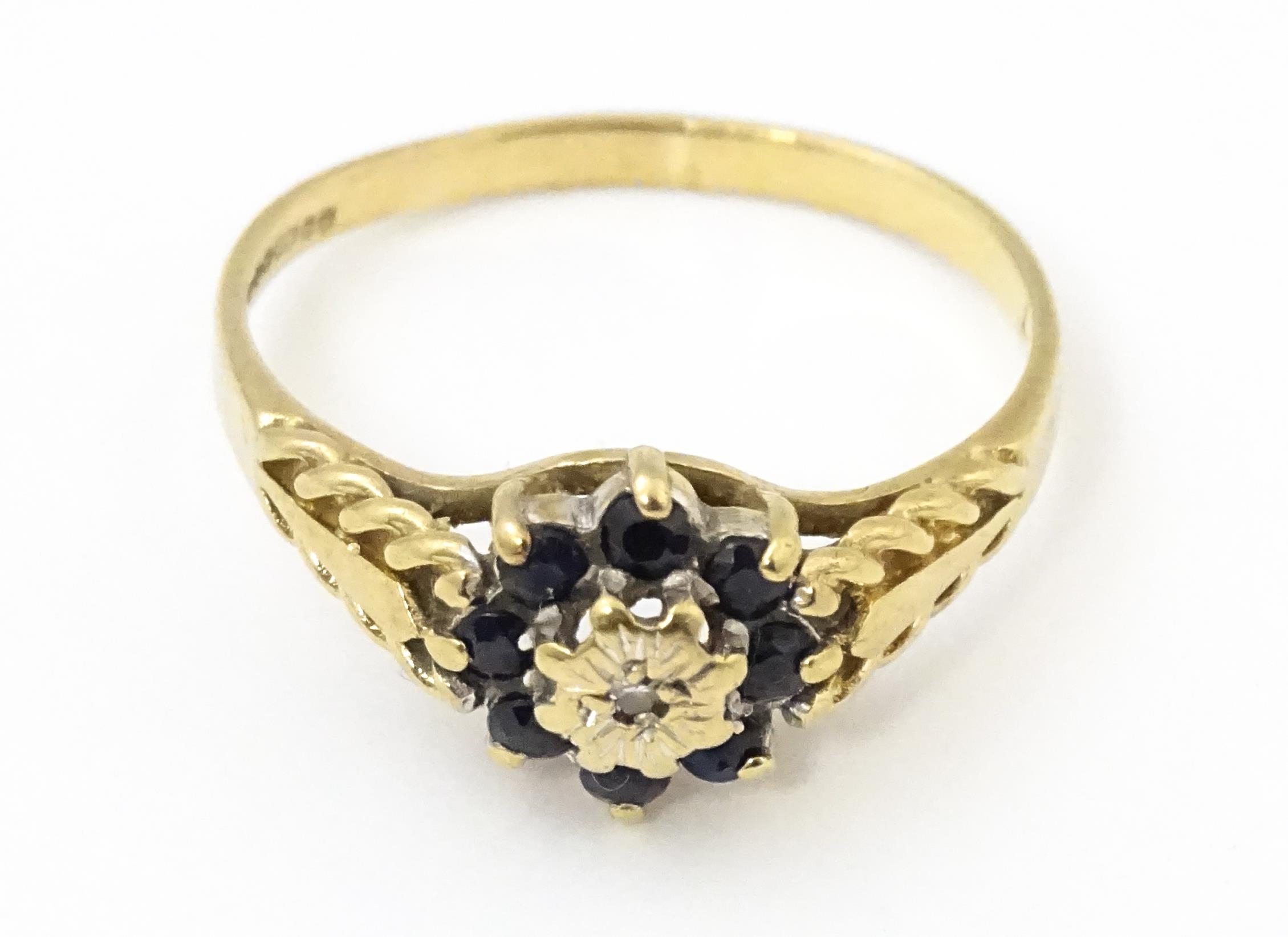A 9ct gold ring set with central diamond bordered by sapphires. Ring size approx. M Please Note - we - Image 3 of 8