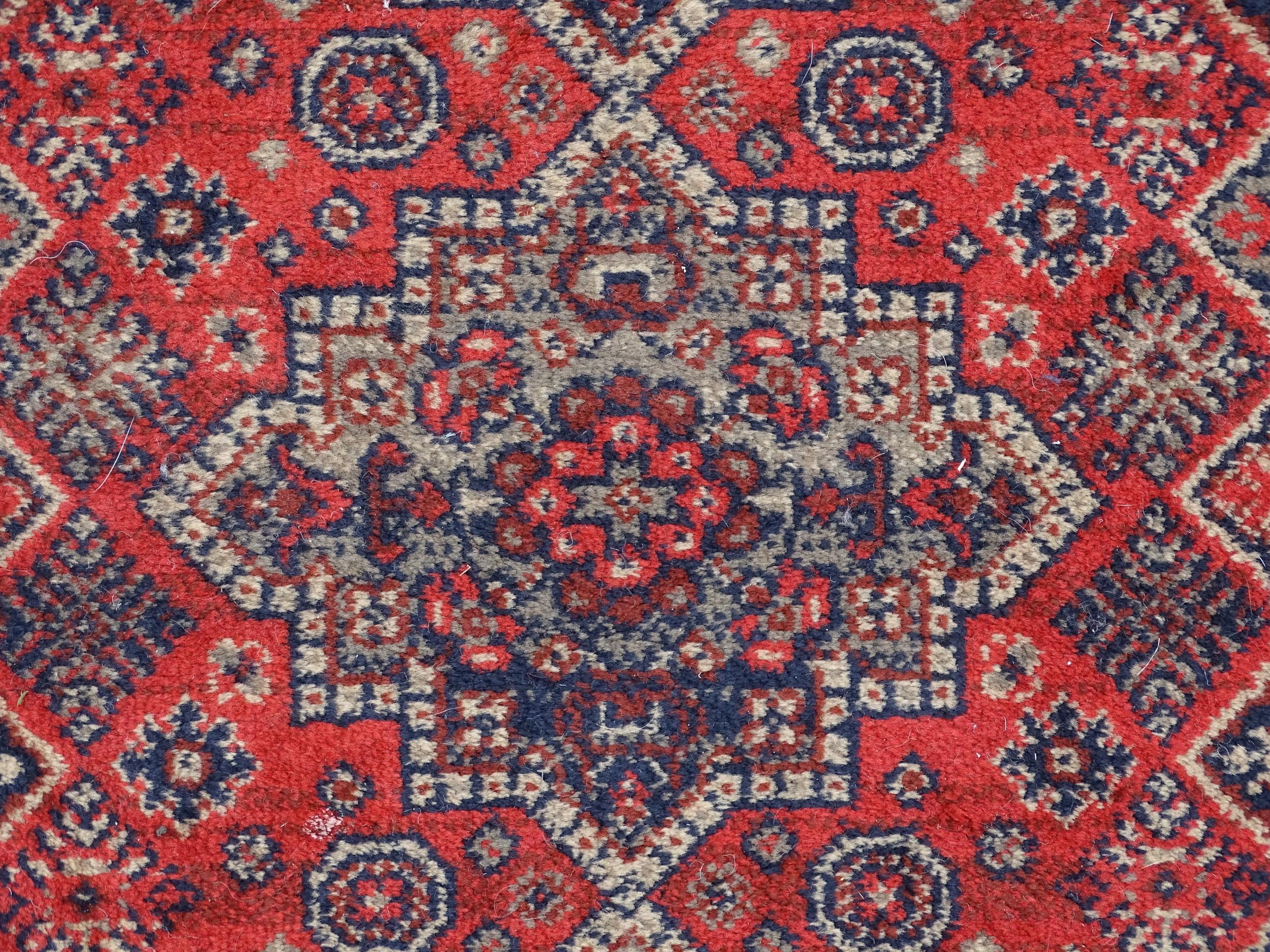 Carpet / Rug : A red ground runner with repeating motifs to centre, bordered by geometric banding. - Image 6 of 8