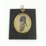 A 19thC silhouette portrait miniature depicting Charles Lamb, aged 23, with gilt highlights, after
