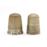 Two silver thimbles one hallmarked Birmingham 1931, maker Henry Griffiths & Sons, the other