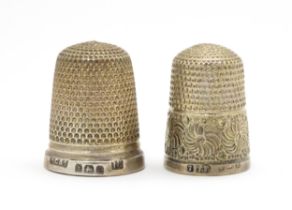 Two silver thimbles one hallmarked Birmingham 1931, maker Henry Griffiths & Sons, the other