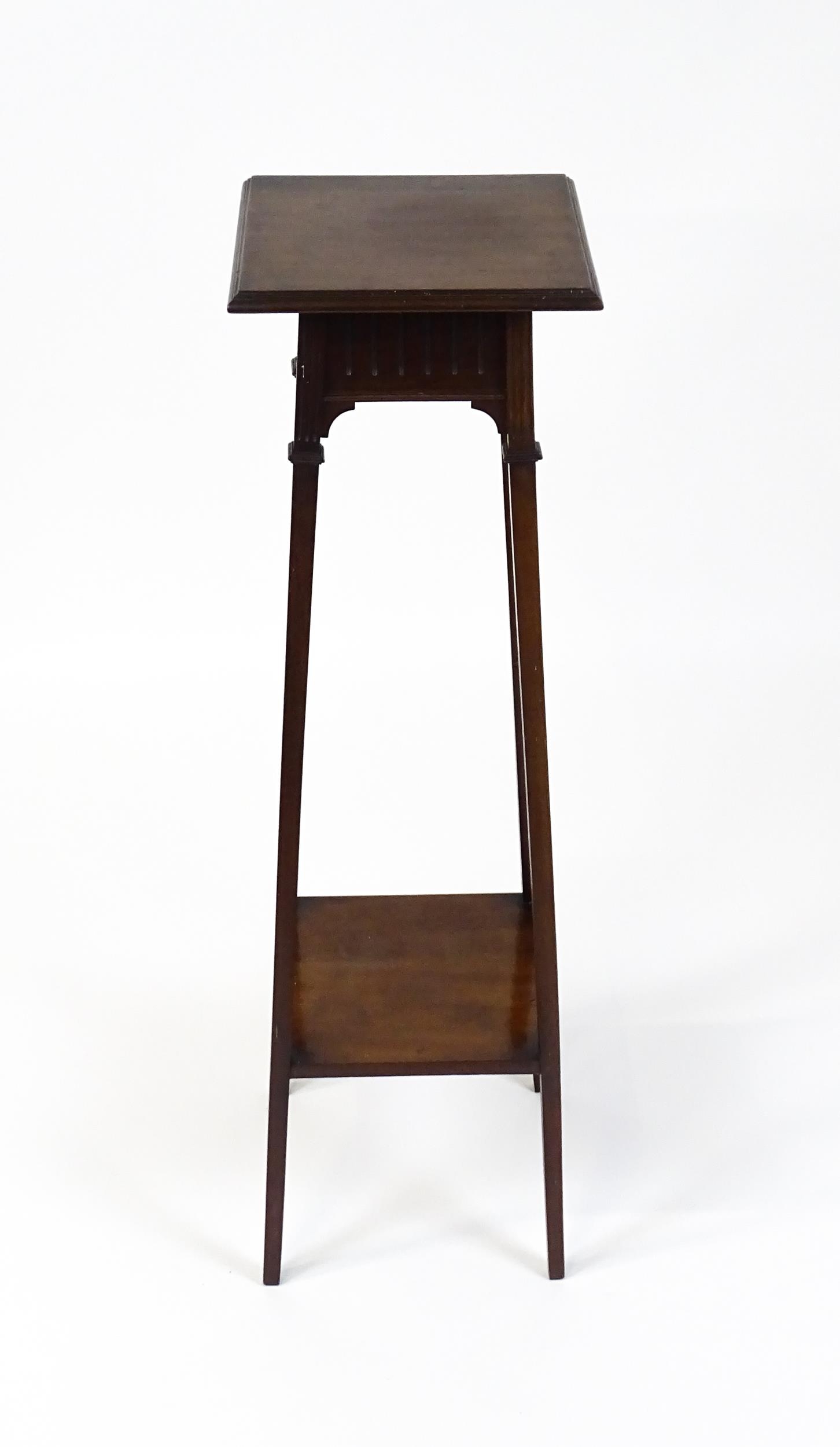 An early / mid 20thC mahogany jardinière stand with a moulded top above a fluted frieze raised on - Image 6 of 7
