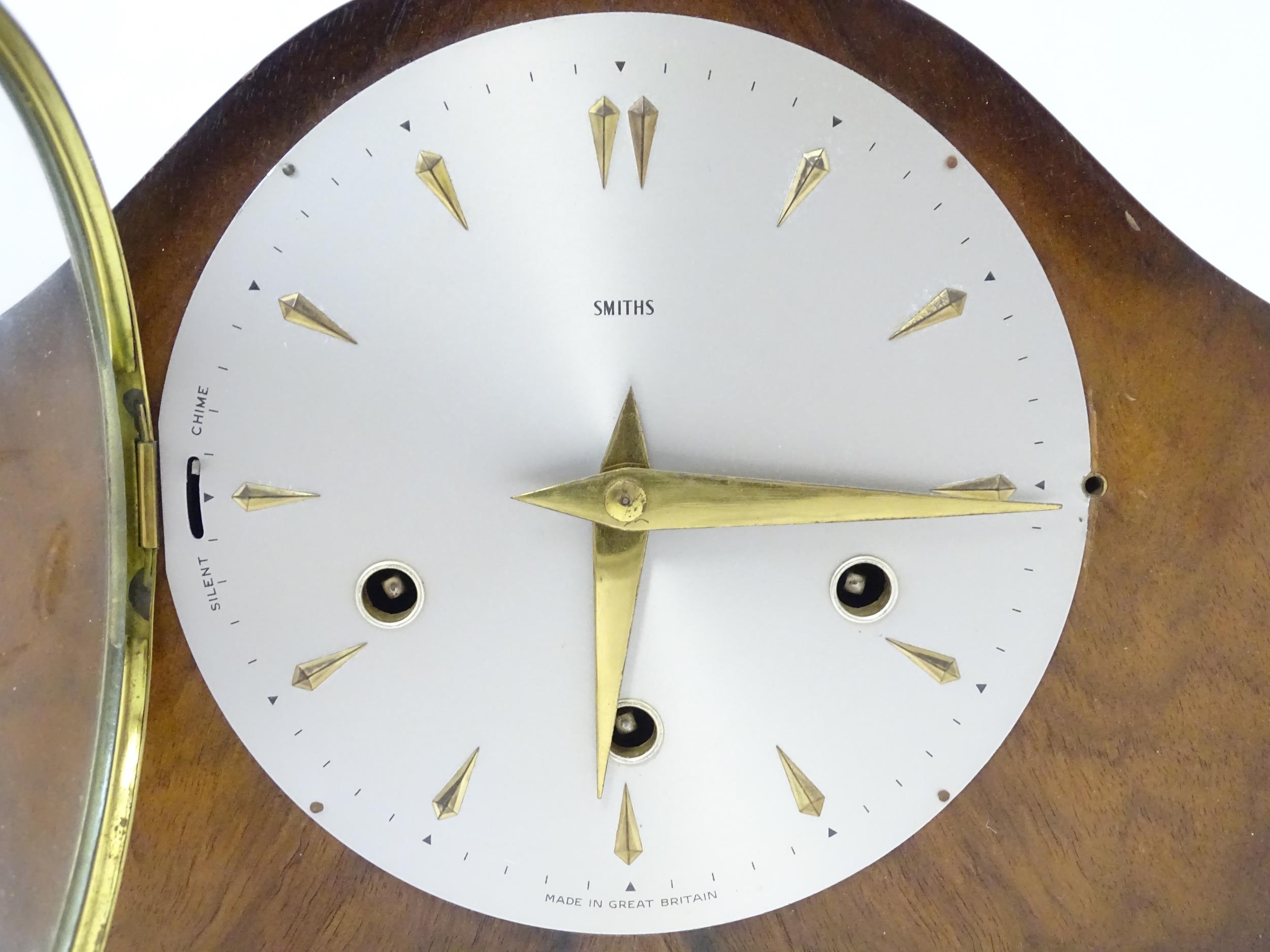 A 20thC smiths walnut cased mantle clock with chiming movement. Approx. 8" high Please Note - we - Image 6 of 9