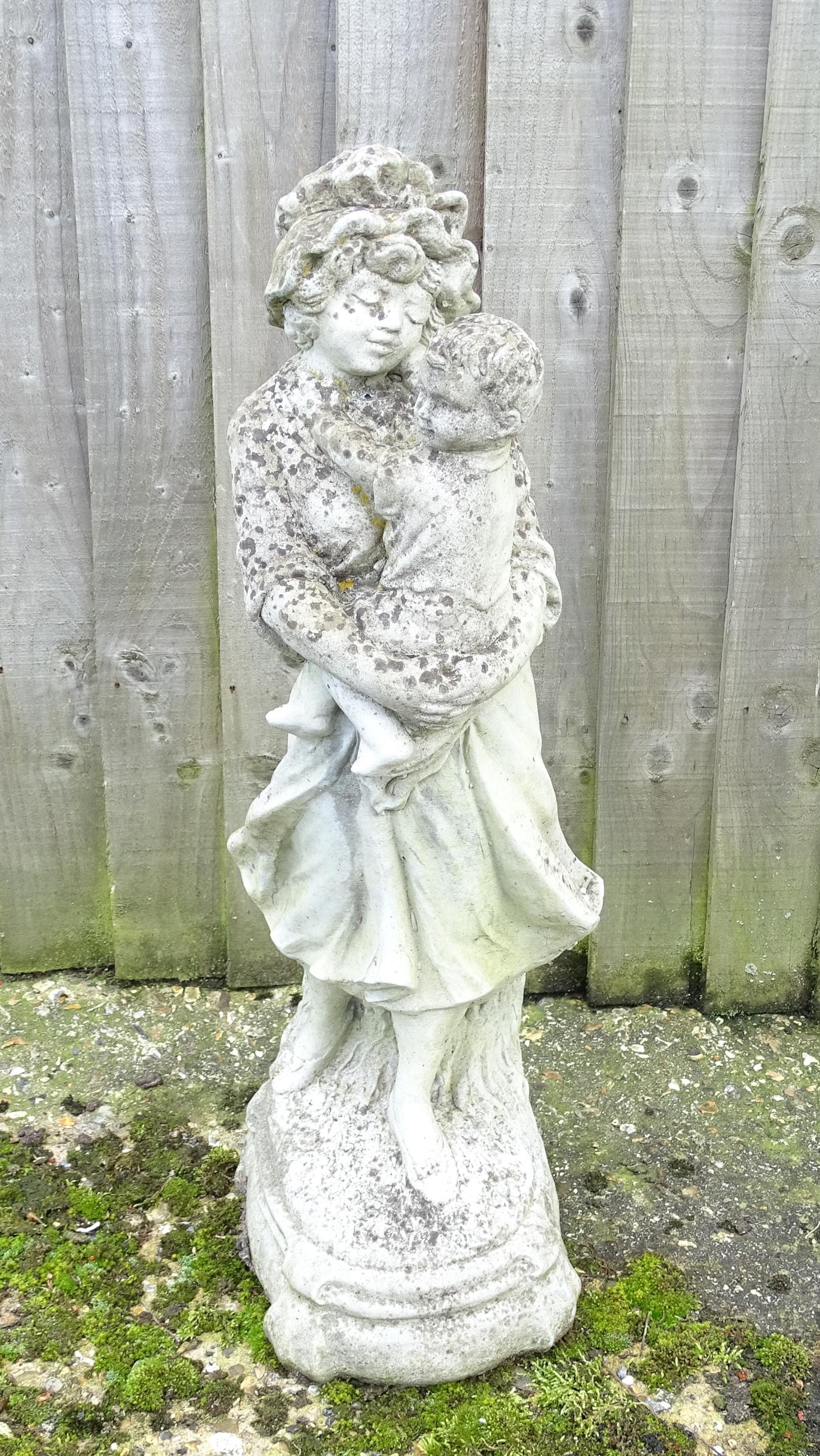 Garden & Architectural : a reconstituted stone statue formed as a mother and child, standing