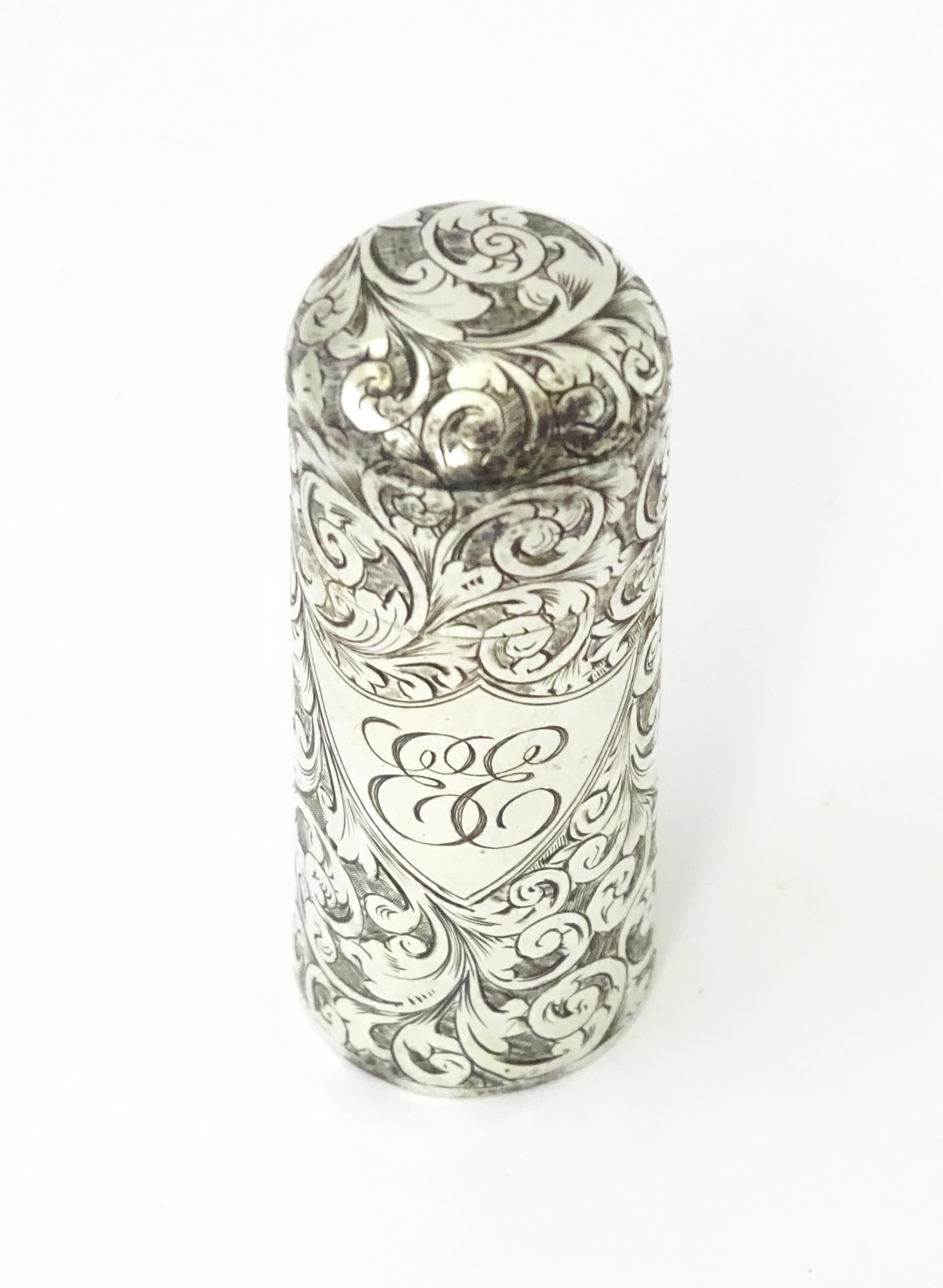 A silver scent / perfume bottle with engraved decoration opening to reveal gilded interior and - Image 2 of 9