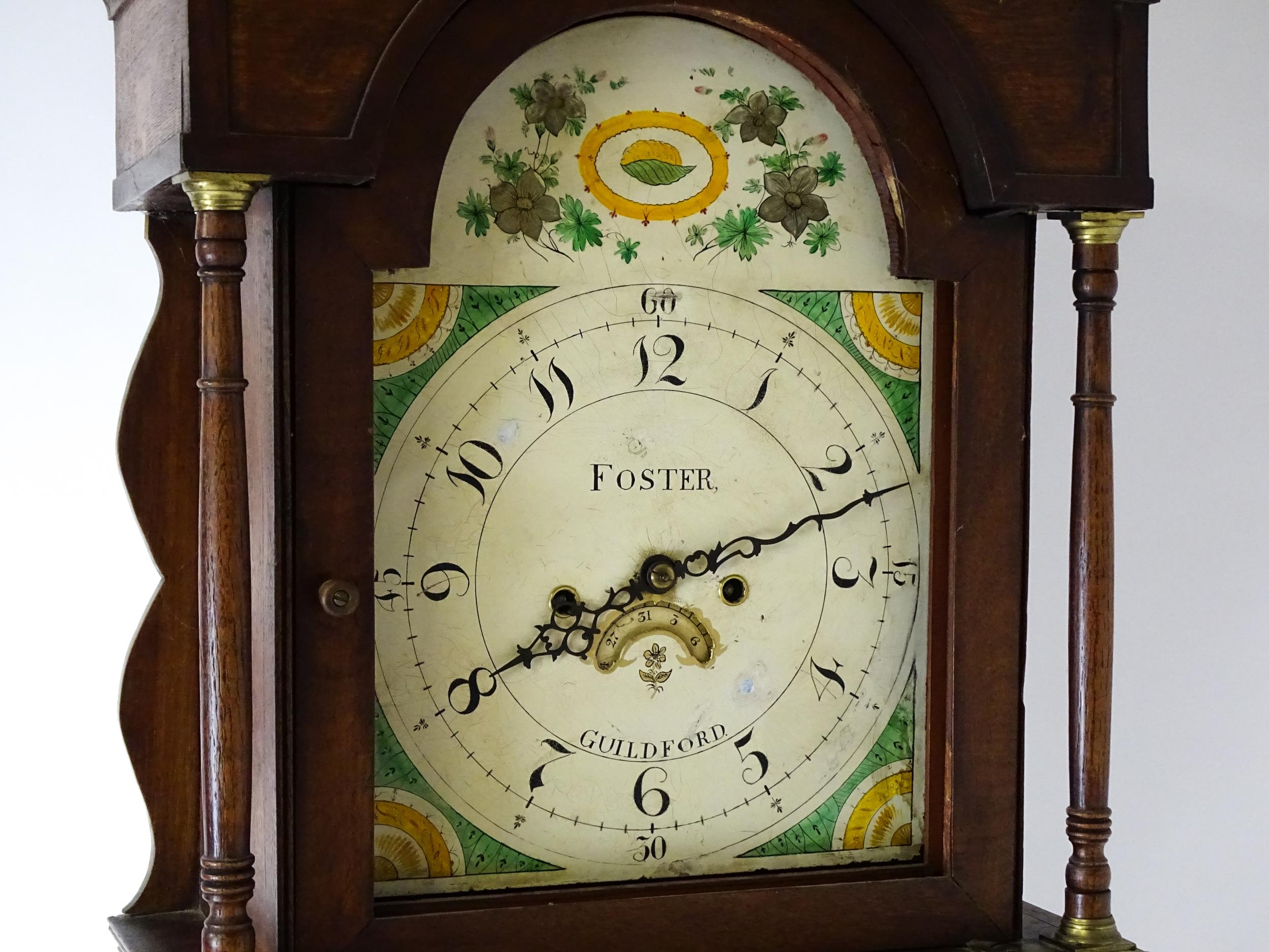 A 19thC oak cased 8-day longcase clock. The painted arch dial signed Foster Guildford. The case with - Image 4 of 10