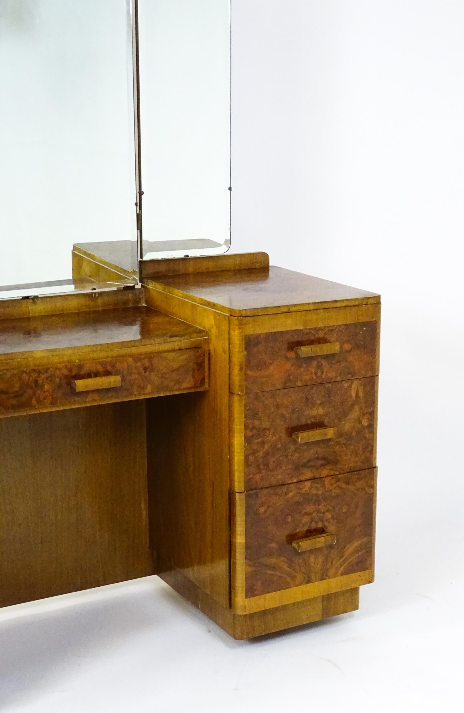 A mid 20thC Art Deco style burr walnut veneered dressing table with a triptych mirror above a - Image 4 of 9