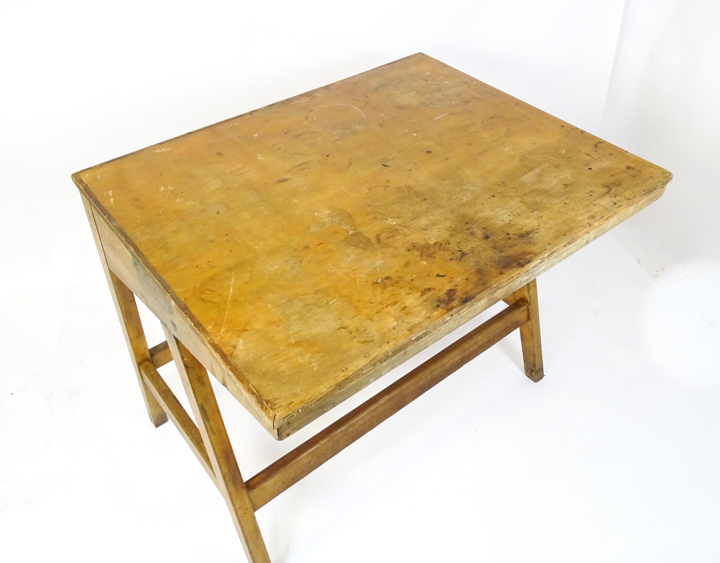 A mid / late 20thC artists desk with a hinged, adjustable top raised on tapering legs united by a - Image 4 of 11