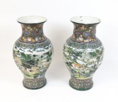 A pair of large Chinese famille verte vases decorated with farming scenes with figures harvesting