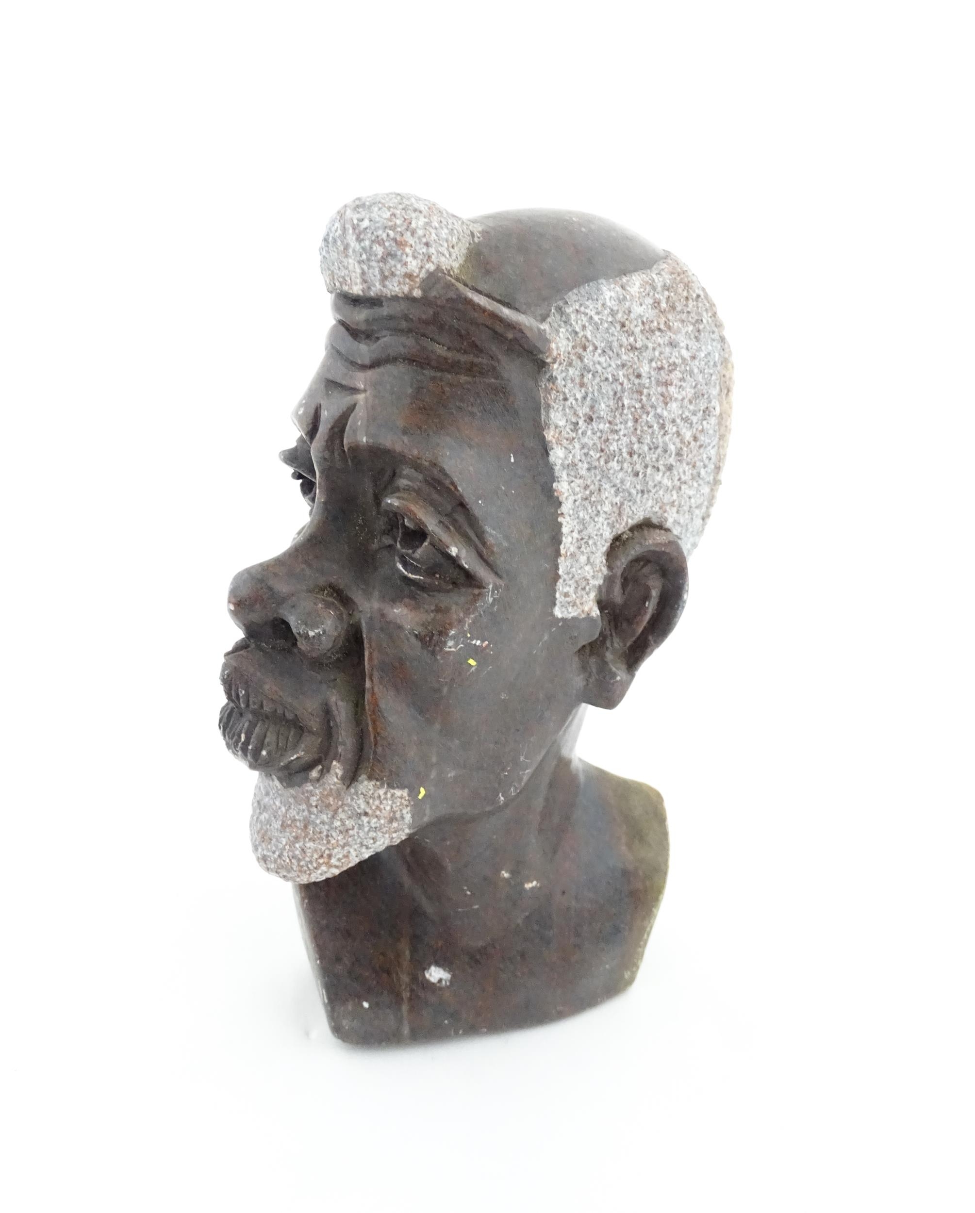 Ethnographic / Native / Tribal : An African carved soapstone bust modelled as the head of a