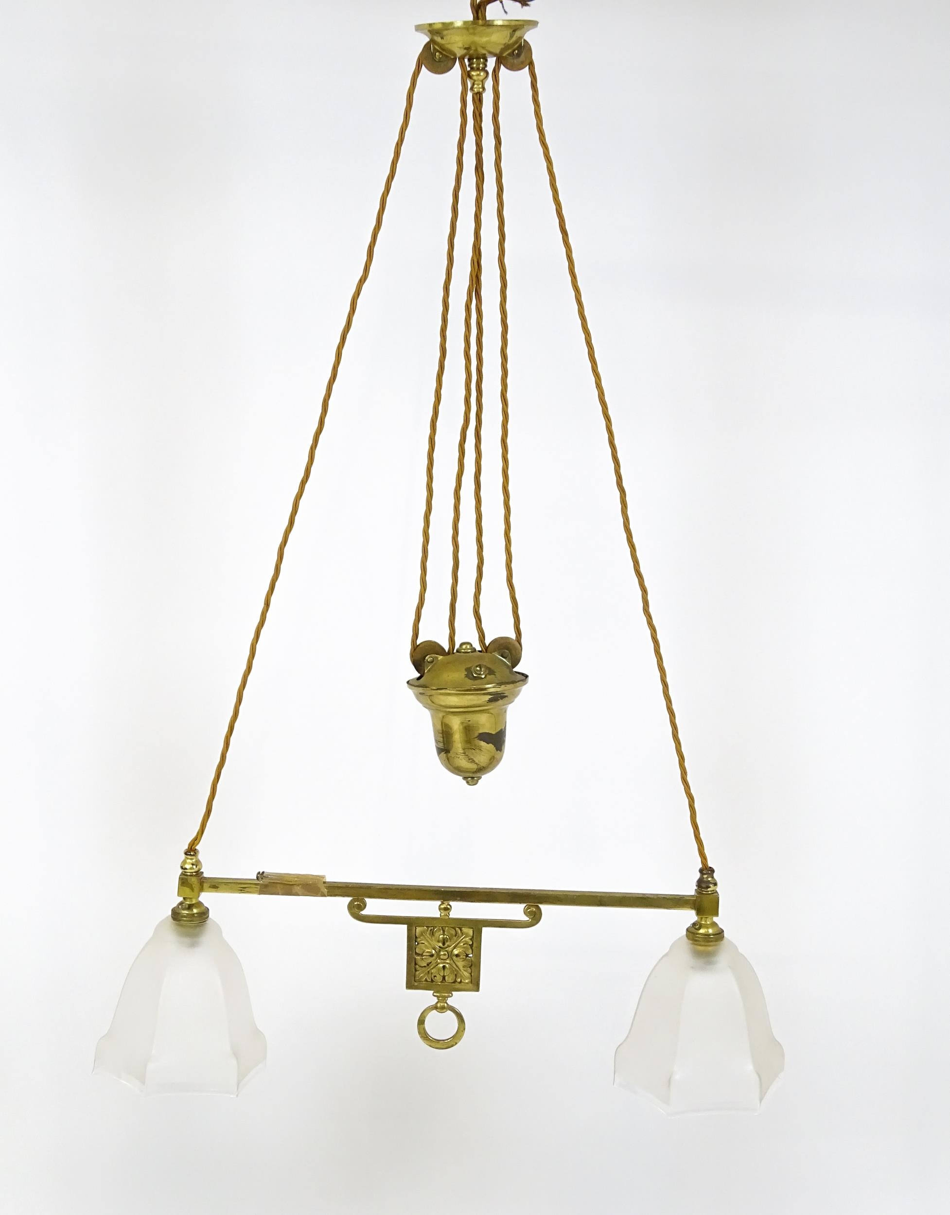 An early 20thC rise and fall adjustable height pendant light with with brass detail and twin frosted - Image 3 of 10